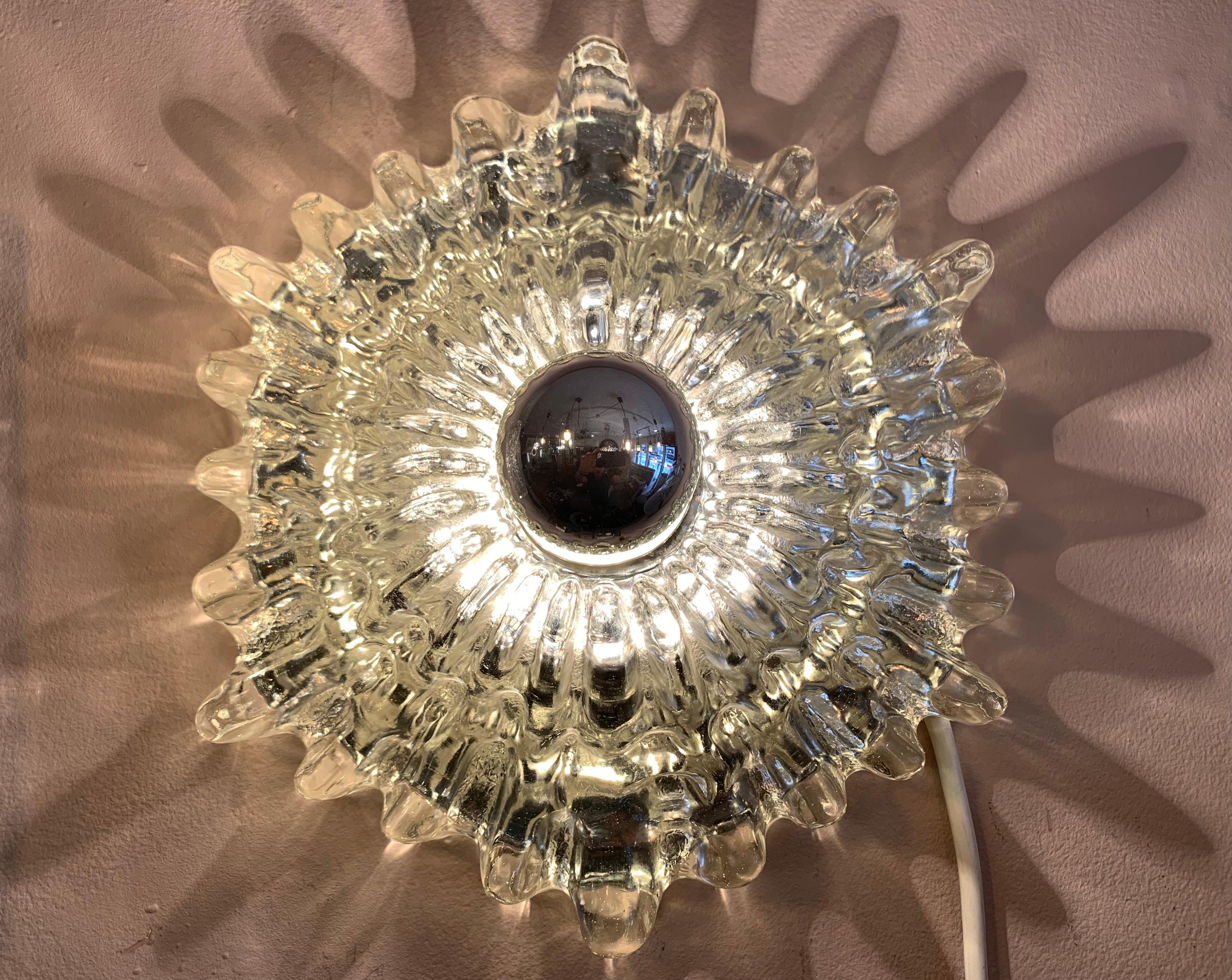 1960s/1970s German Hillebrand Leuchten hexagonal, textured, clear and silver glass wall light or wall sconce which could even be used as ceiling flush mounts. The thick glass is heavy with a deep textured sunburst shaped pattern. A single E26/E27