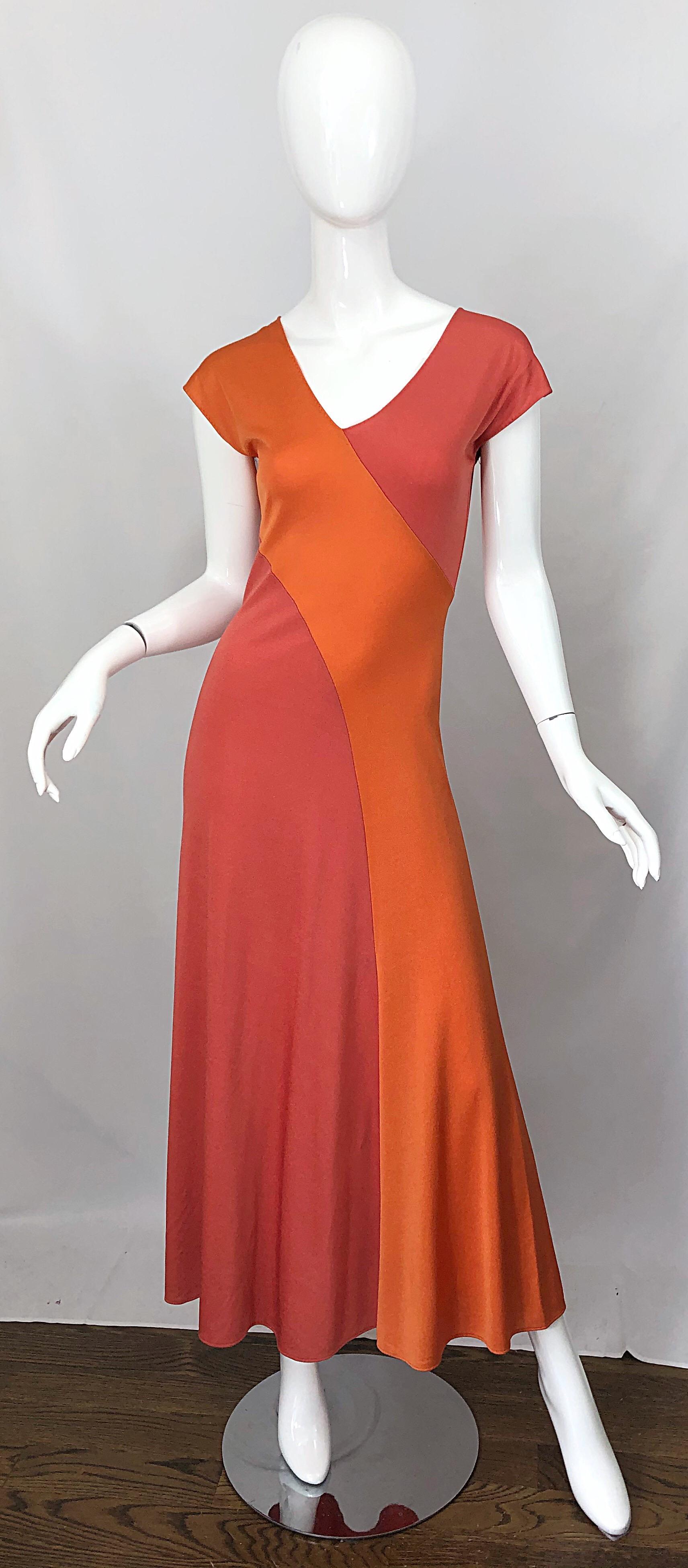 Slinky 1970s HIROKO salmon and coral color blocked jersey bias cut maxi dress! This beauty simply slips over the head and stretches to fit. Slimming diagonal stripes on the front and back. Can easily be dressed up or down. Great with flats, sandals