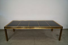 1970's Hollywood Regency Art Deco Brass & Dark Smoked Glass Dining Table