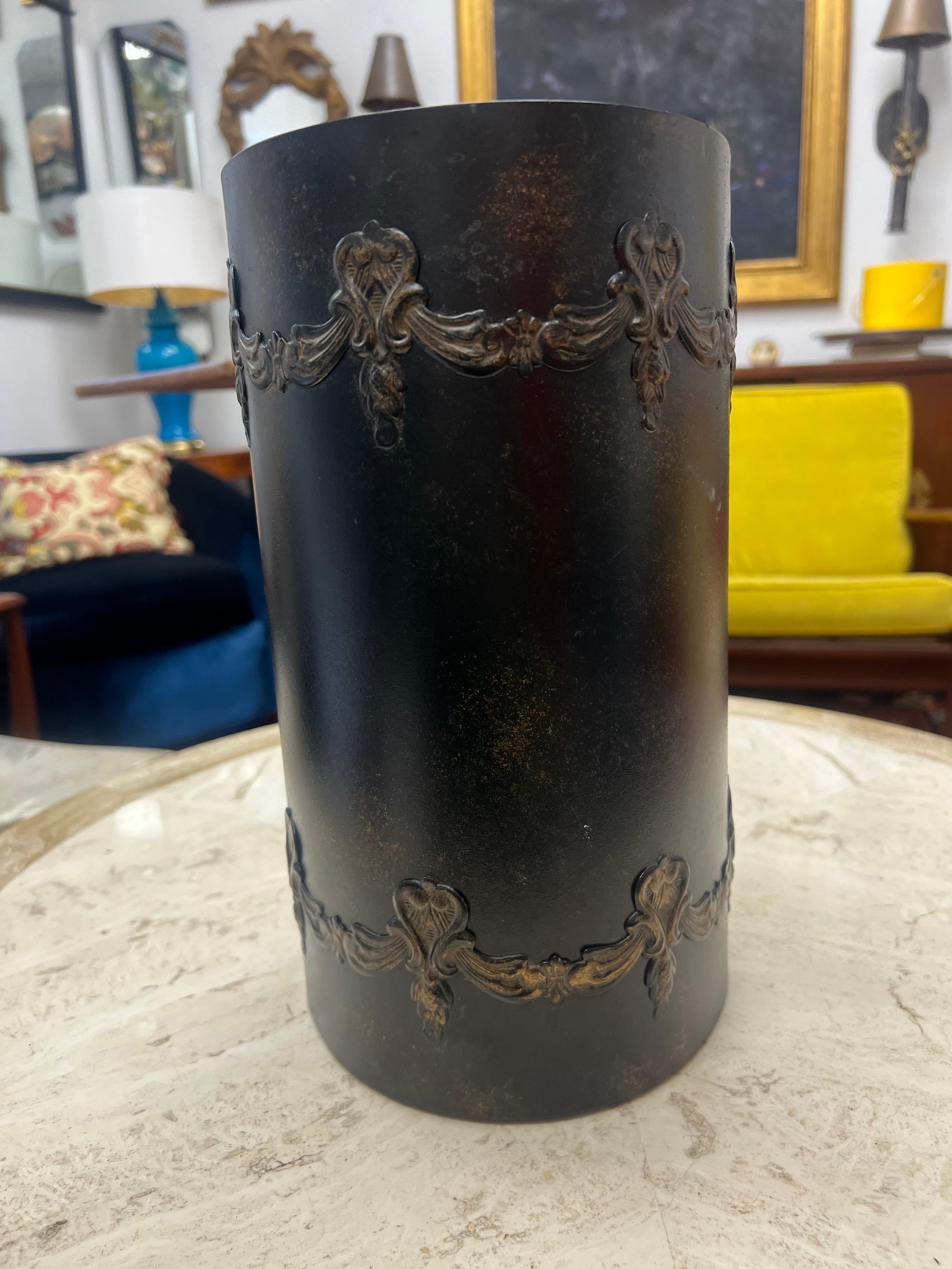 Hollywood regency black and antiqued gold metal Wastebasket.  It is clean and ready to use.   Nice details and well made. Circa 1970’s.
