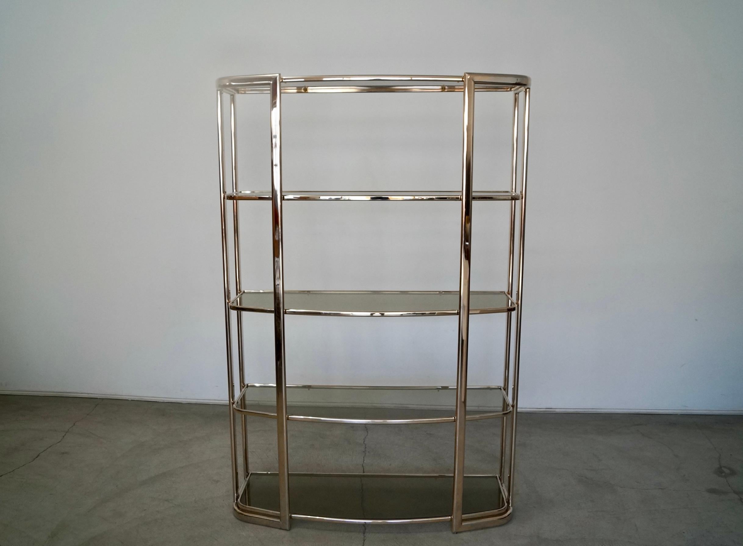 Vintage Mid-Century Modern shelf for sale. Great Art Deco design from the 1970's, and really well made. It has five smoked glass shelves, and is a beautiful etagere or room divider. It's in incredible condition, and is definitely a piece to add to
