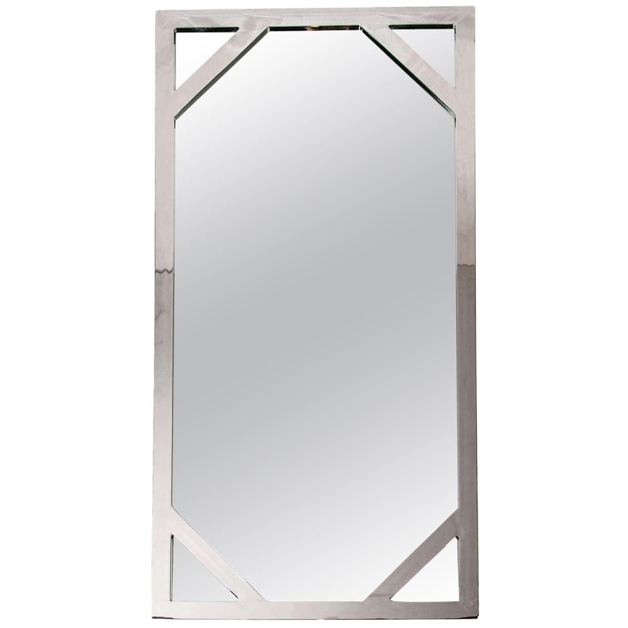 Mid-Century Modern rectangular mirror in solid steel with a chrome finish, attributed to Milo Baughman for D.I.A.. The minimalist mirror has a lattice design along the corners, reminiscent of 1970s Chinese Chippendale designs. 
Please note the