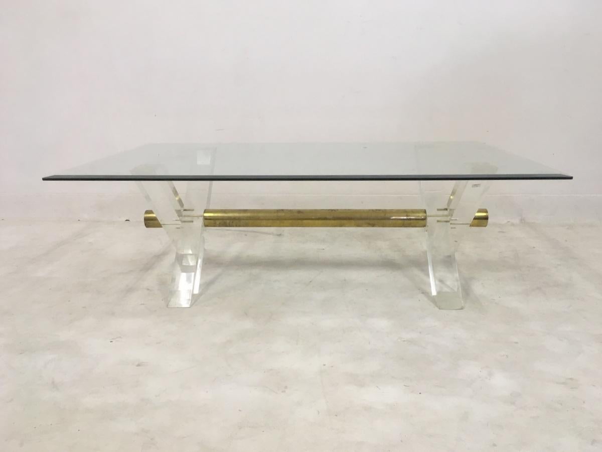 Lucite coffee table

X-shaped base

Thick brass centre rod

French, 1970s.