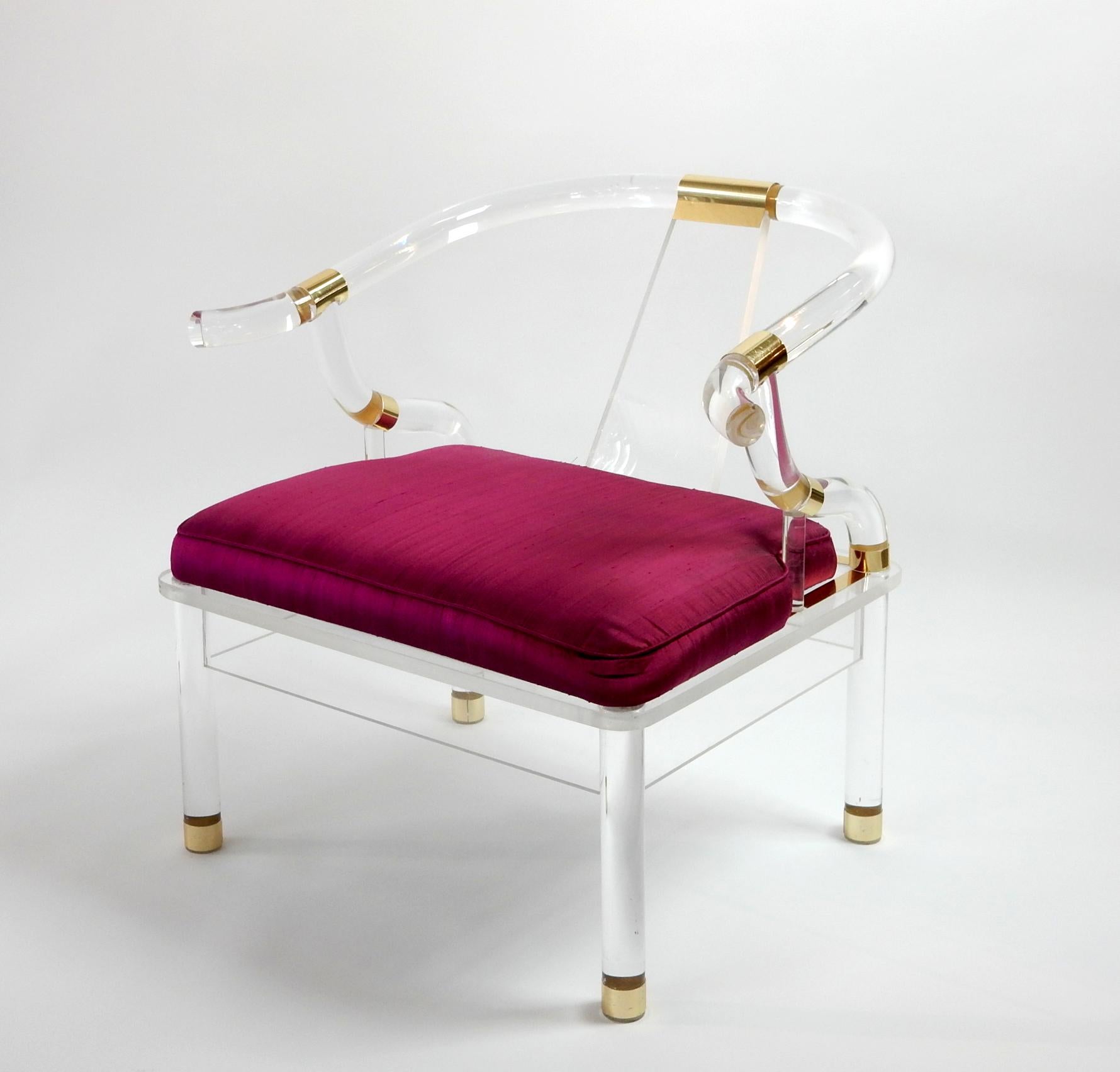 Fabulous Ming lounge chair formed of thick Lucite banded in brass.
A rare piece of sculptural art furniture which is perfect for an eclectic space. 
Overall exceptional condition with no damage or repairs.
Not signed or marked by designer. Heavy
