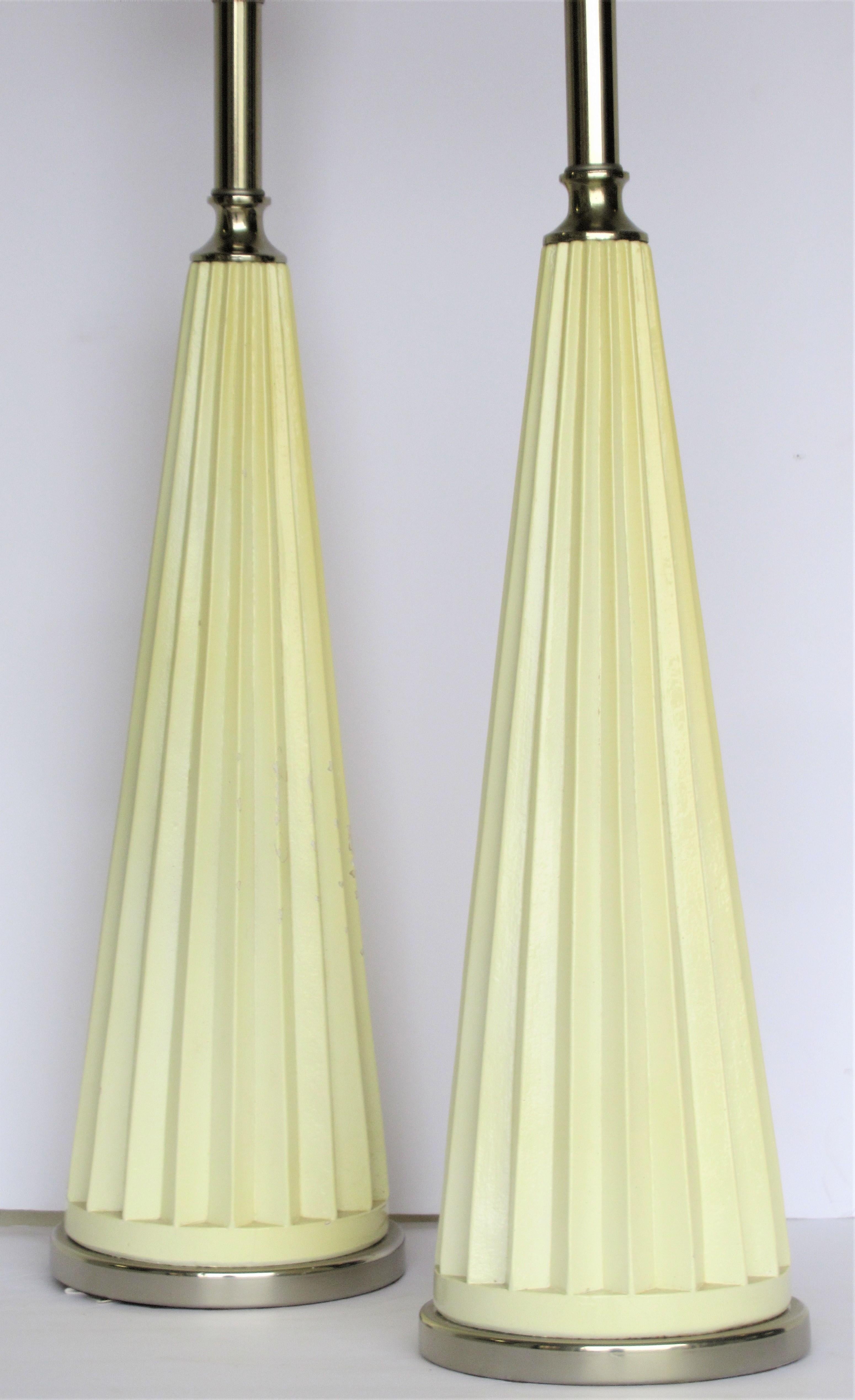 A great looking pair of rich cream white satin gloss lacquer painted composite and chrome tall fluted pyramidal obelisk table lamps by Fortune Lamp Co. - dated 1973 ( signed at bottom - see picture 9 ) Measure: 7 inches across base / 40 inches high