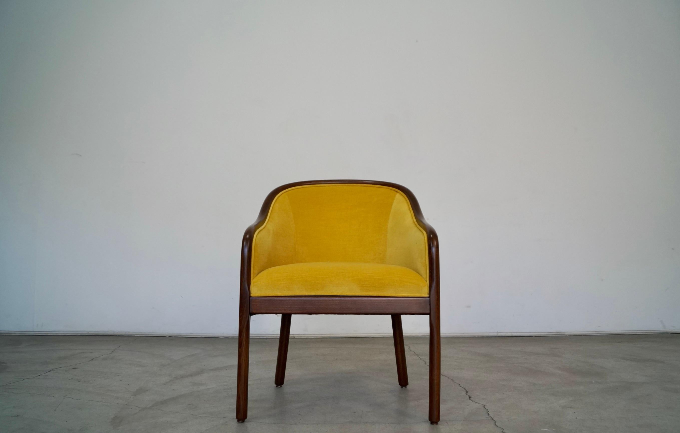 Vintage 1970s armchair for sale. Designed by Ward Bennett in the 1970s, and has been professionally refinished and reupholstered in new fabric and foam. The frame is solid beechwood, and has been refinished in walnut. It has been reupholstered in a