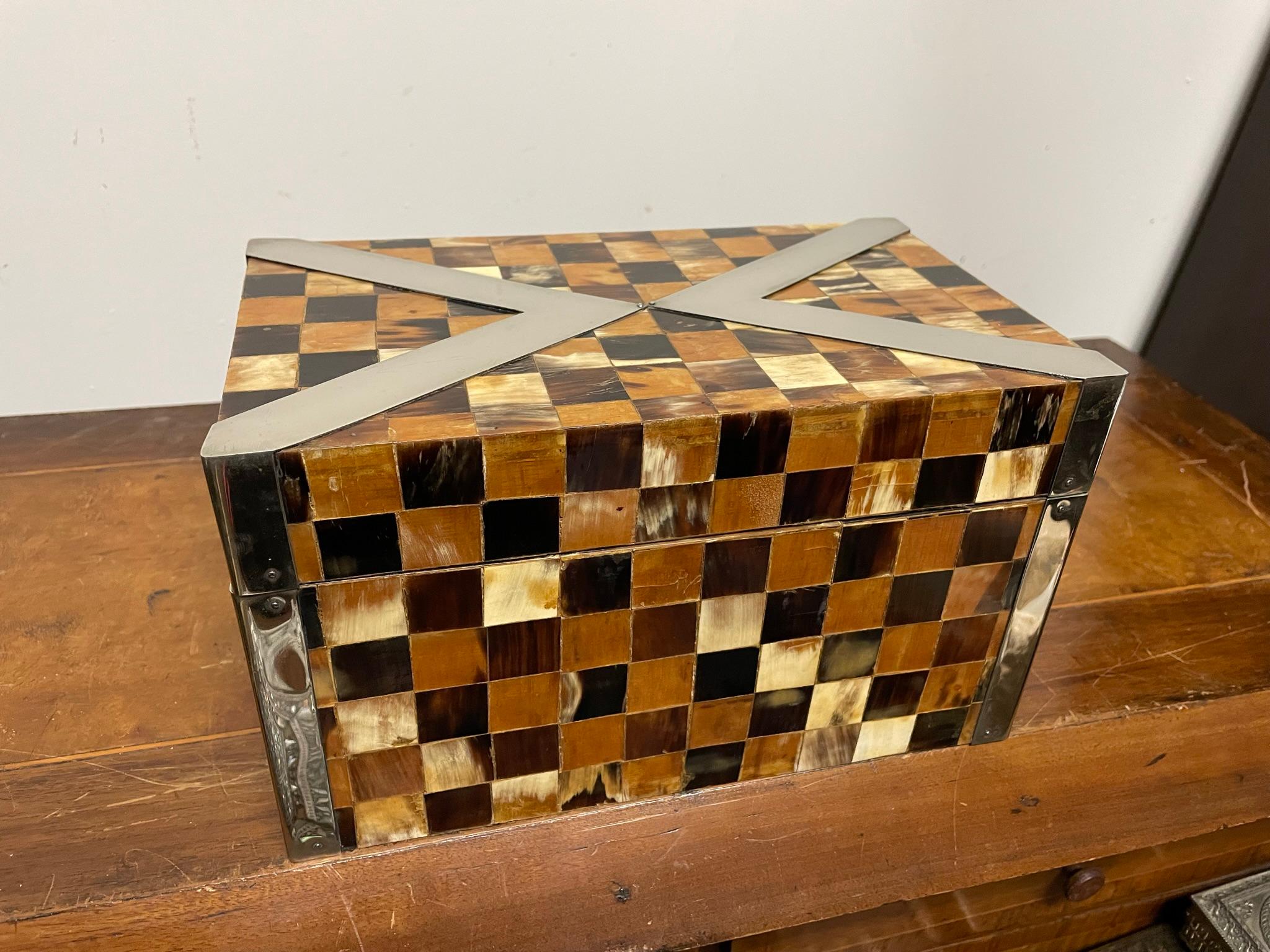 Stunning desk or table top box with checkerboard horn veneer and polished steel decoration. A beautifully made box showing true craftsmanship, with innovative exterior hinges. Stamped Rudolph Collection, made by the seminal Miami based designer