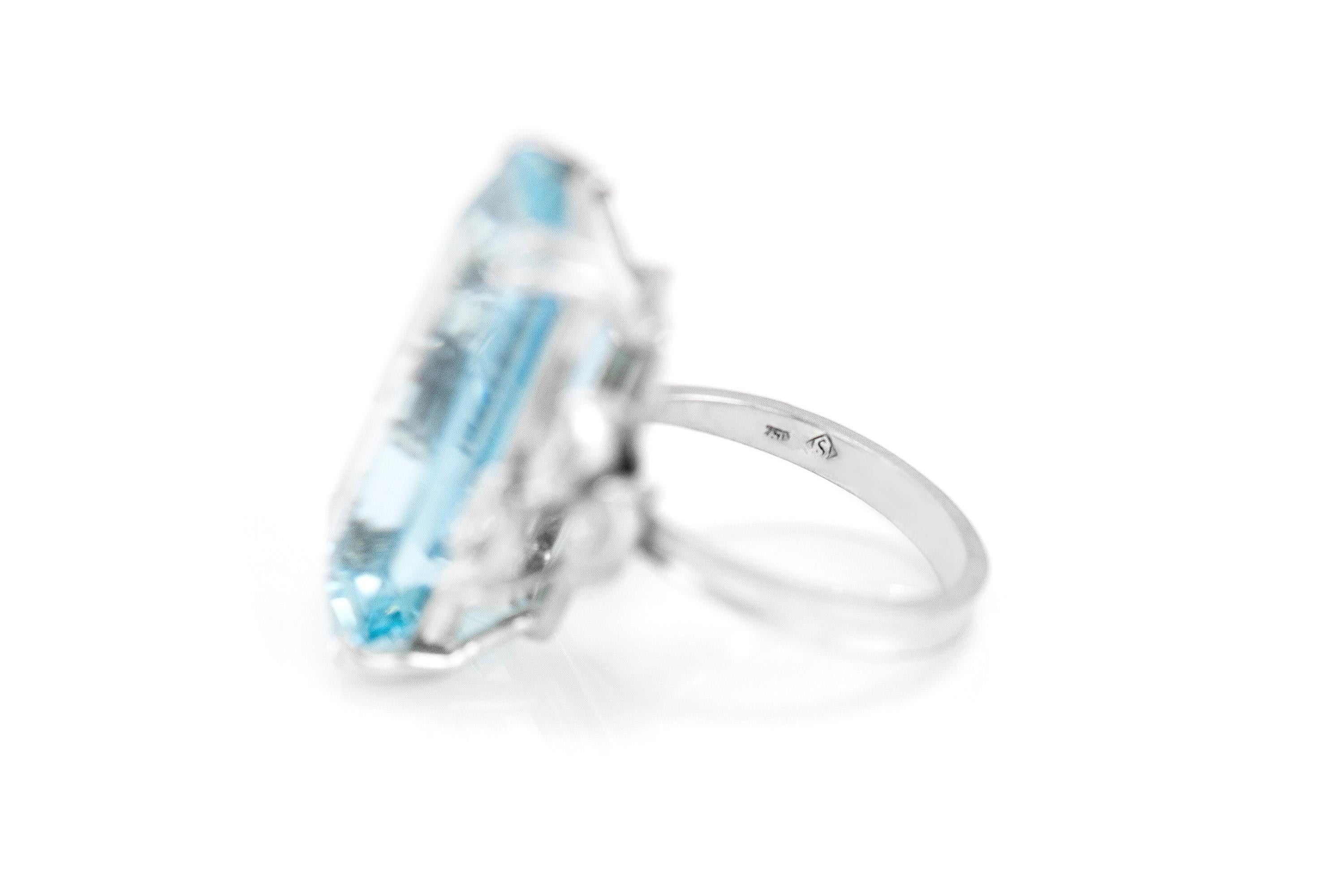 The beautiful ring is finely crafted in 18k white gold with aquamarine center stone weighing approximately a total of 25.00 carat and marquise side diamonds weighing approximately a total of 0.60 carat.
Circa 1970
Signed by H.STERN