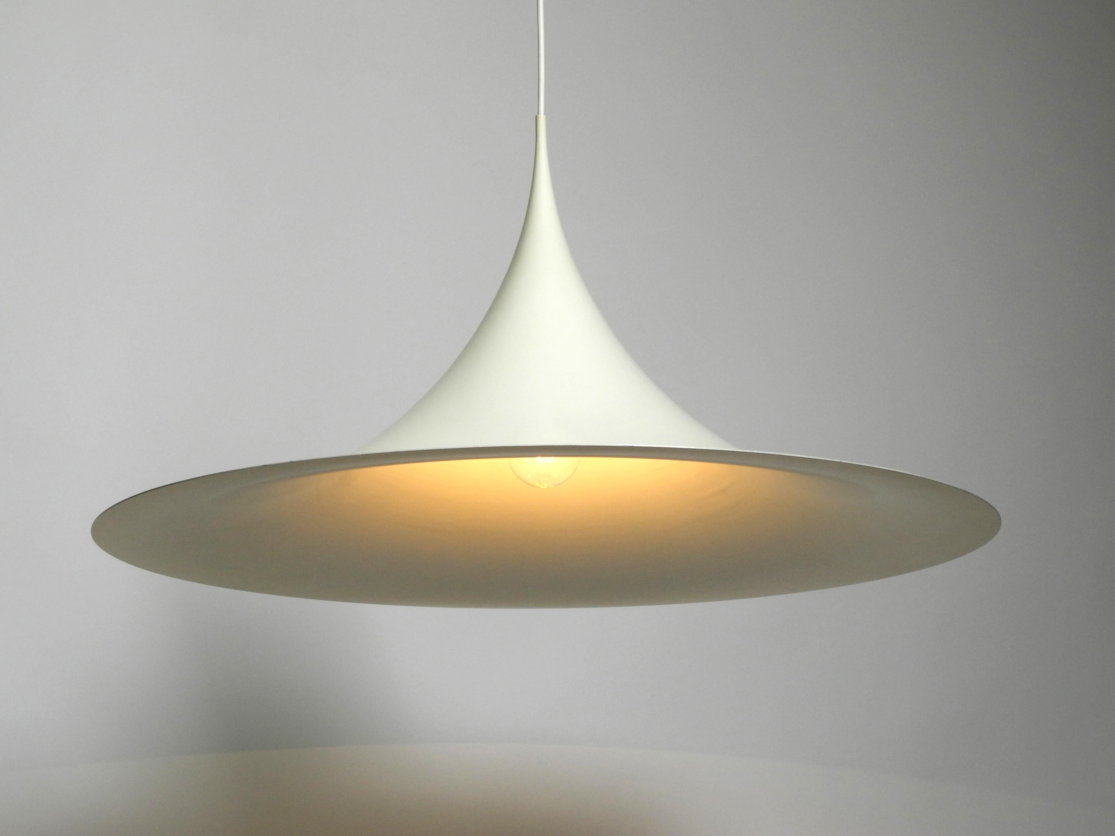 Original 1970s XXL huge Fog & Morup Semi pendant lamp with a diameter of 70 cm.
Outside and inside white. Very rarely found in this size.
Design: Thorsten Thorup / Claus Bonderup Manufacturer: Fog & Morup, Made in Denmark.
Very good vintage