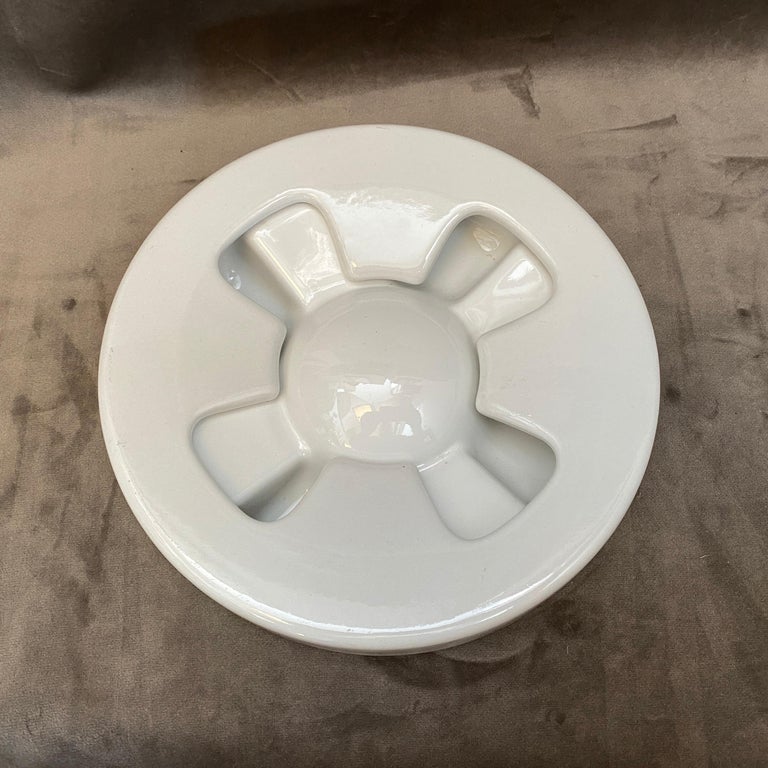 A Mid-Century Modern ceramic ashtray made in Italy in the Seventies. It's designed by Angelo Mangiarotti. It's marked and labeled on the bottom.