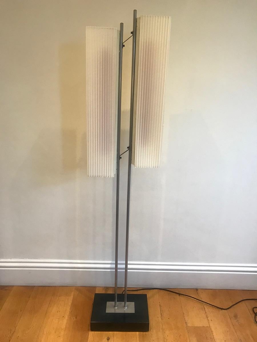 A very original possibly German floor lamp with two illuminating plastic corrugated original shades. The lamp has been rewired to take LED lights to avoid overheating. There is a slight discolourisation to the shades where the originals have heated
