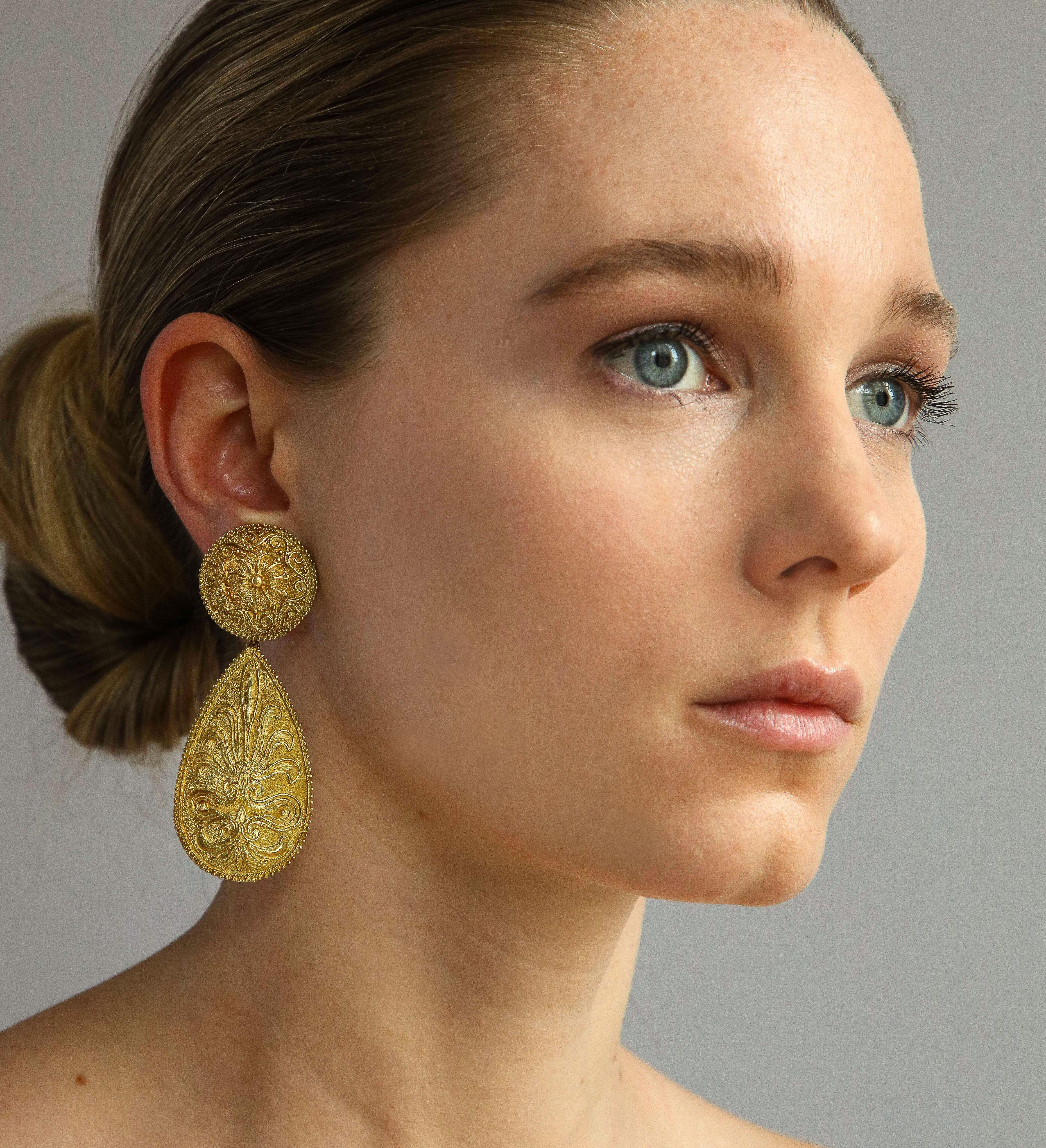 Sophisticated for dinner or poolside 1970s 18K gold pendant earrings with classic Italian decorative motifs offering a rich look and subtle movement. Maker mark AL, gold mark  750, and registry numbers. Measuring 1 1/8 inch wide x 2 7/8 inches long.