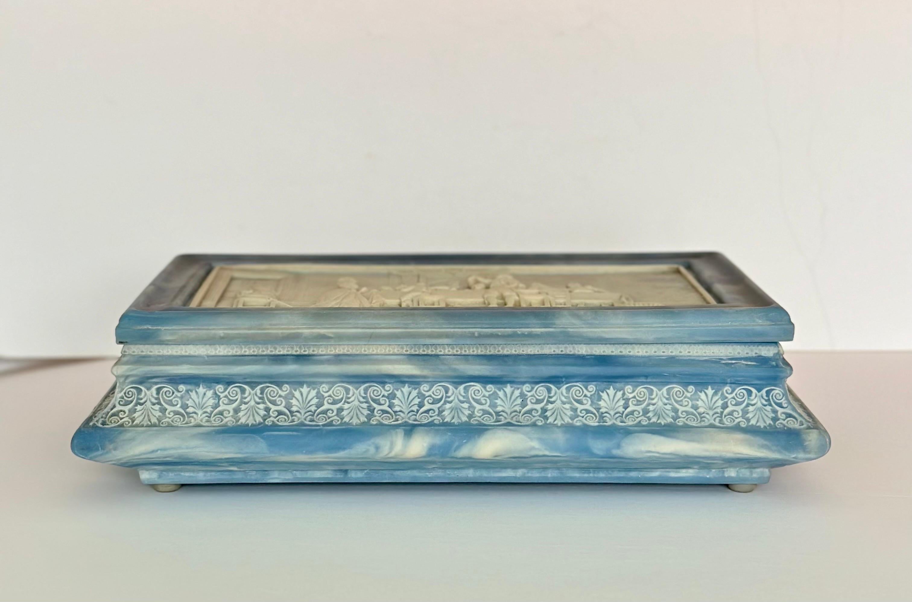 We are very pleased to offer a beautiful decorative box, circa the 1980s.  This box is a true masterpiece, boasting the artistry and craftsmanship that Incolay stone is renowned for.  The material itself is a remarkable blend of natural minerals and