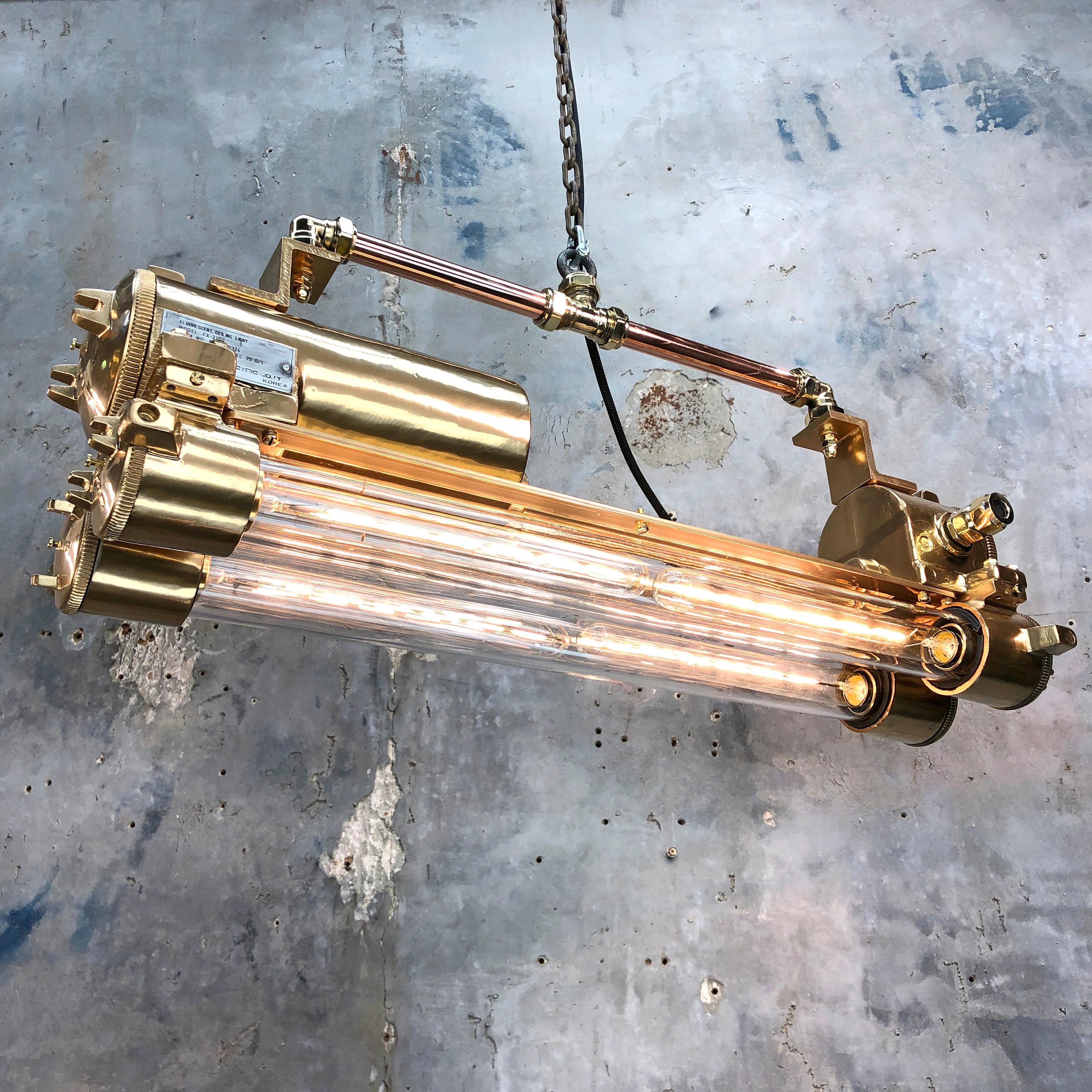 Reclaimed vintage industrial Korean flameproof striplight made by Daeyang in the 1970's finished with mirror gold acrylic and adjustable suspension bar.

Original item salvaged from supertankers and military vessels then professionally restored