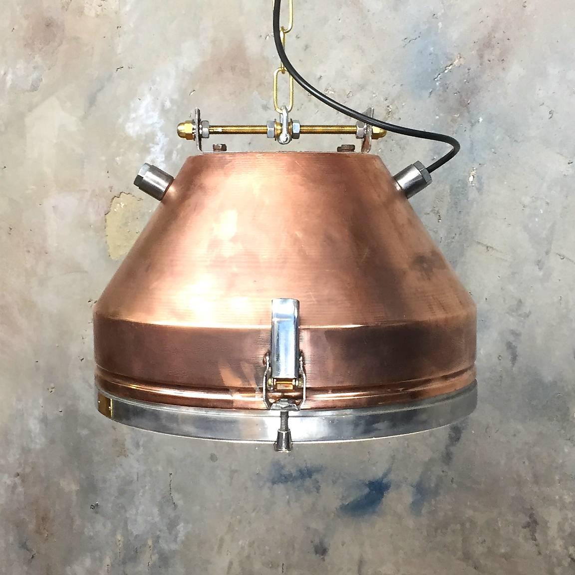 VEB copper and aluminium pendant with target grill.

VEB was formed in the early 1950s and was the biggest Luminaire manufacturer in the GDR.
 
The publicly owned operation (German: Volkseigener Betrieb; abbreviated VEB) was the main legal form