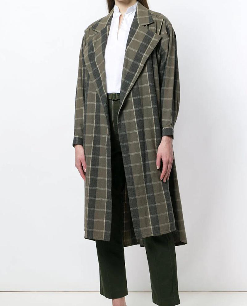 1970s oversize check coat

circa 1970s
khaki green/grey
cotton
tartan check pattern
wide notch lapels
concealed front fastening
drop shoulder
long sleeves
buttoned cuffs
high-low hem
mid-length

Cotton 100%

size S