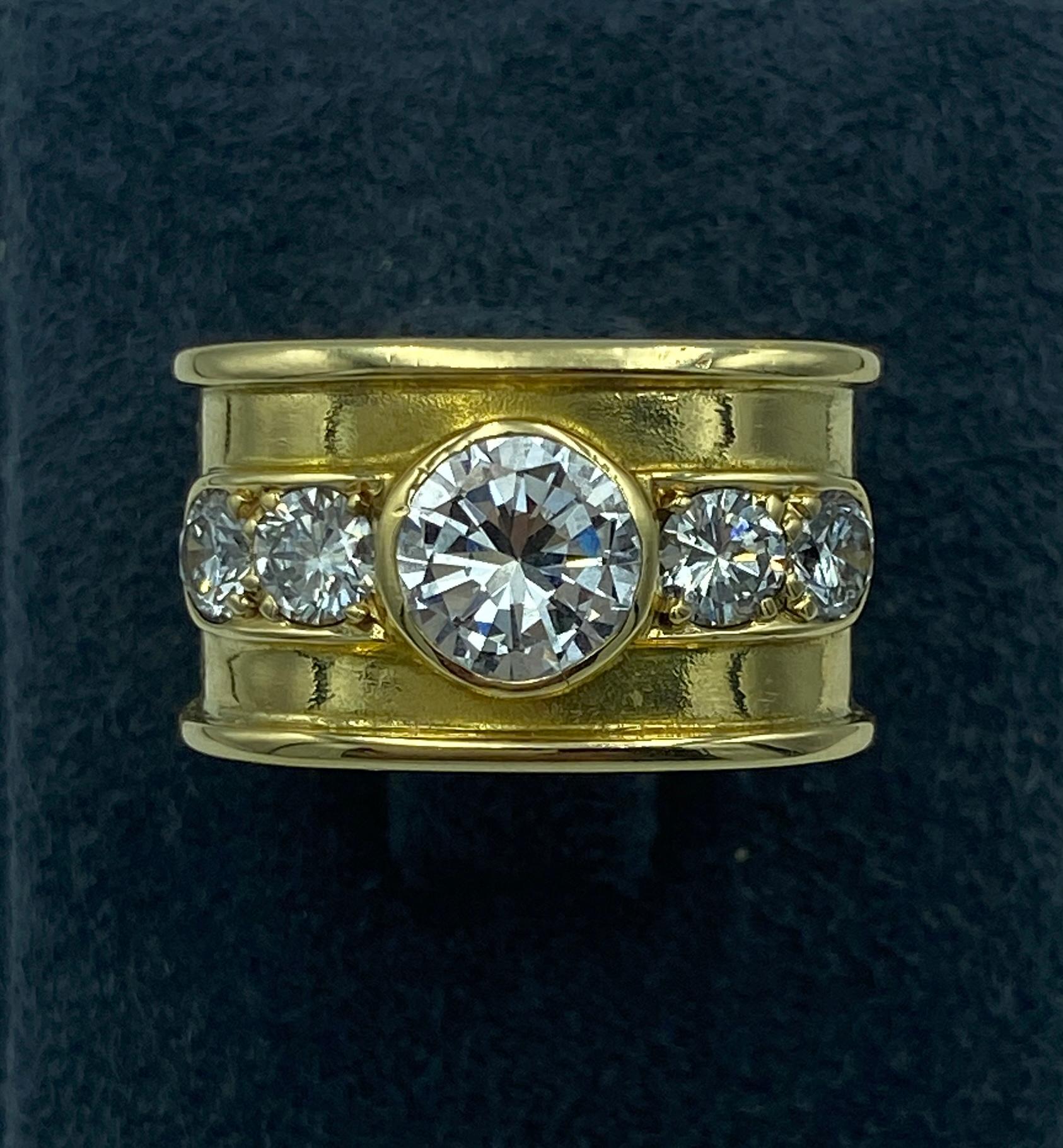 A striking 1970s Italian made 18 carat and diamond cocktail ring. The ring has a rounded angular shape. Its centre stone is approximately 1 carat and the 4 smaller round cut diamonds are approximately 0.25 carat.

It is a most elegant ring that can