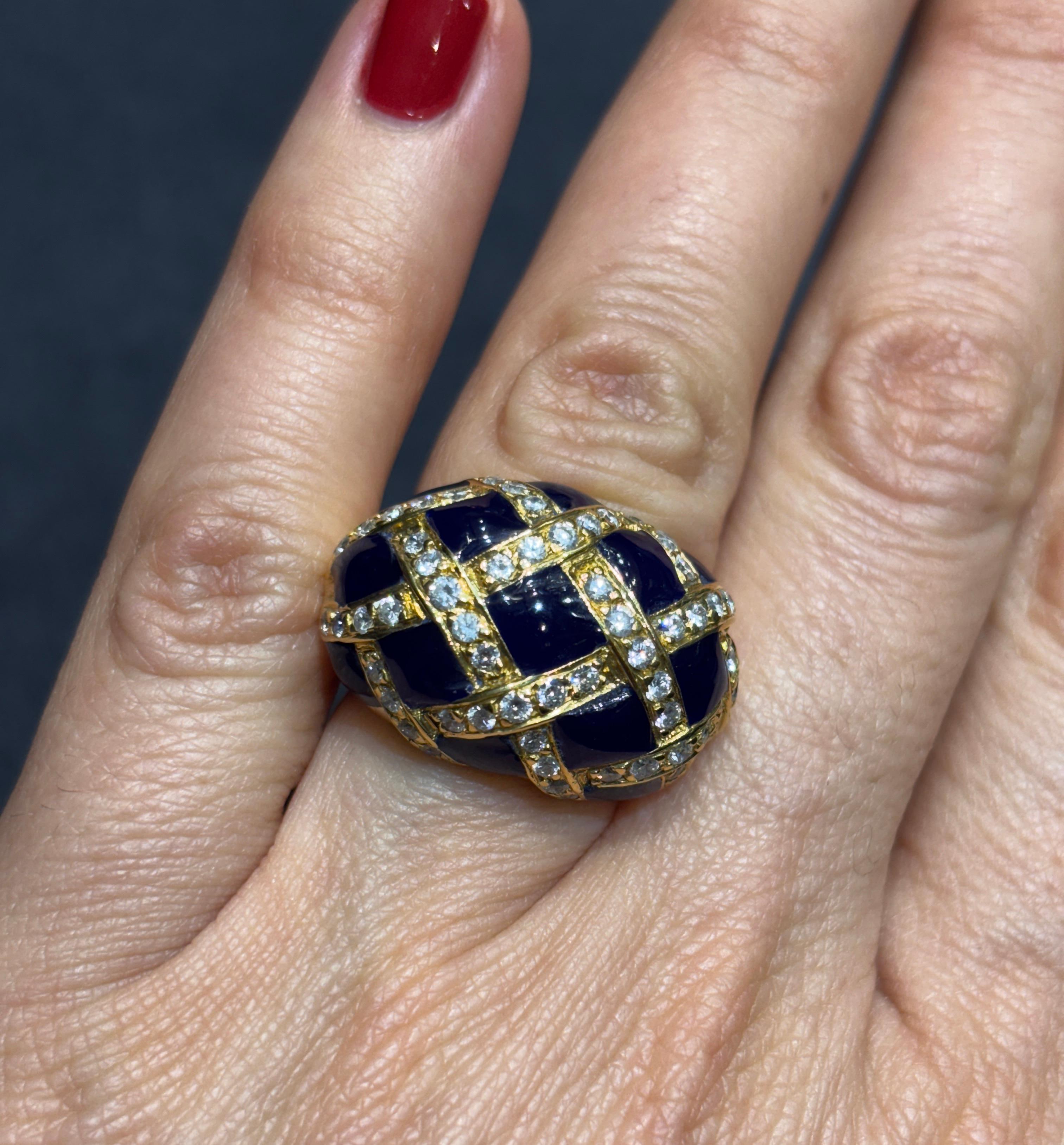 This stunning 1970s 18k gold ring is designed as a latticework of diamonds and enamel. The ring consists of approximately 0.8 c diamonds.