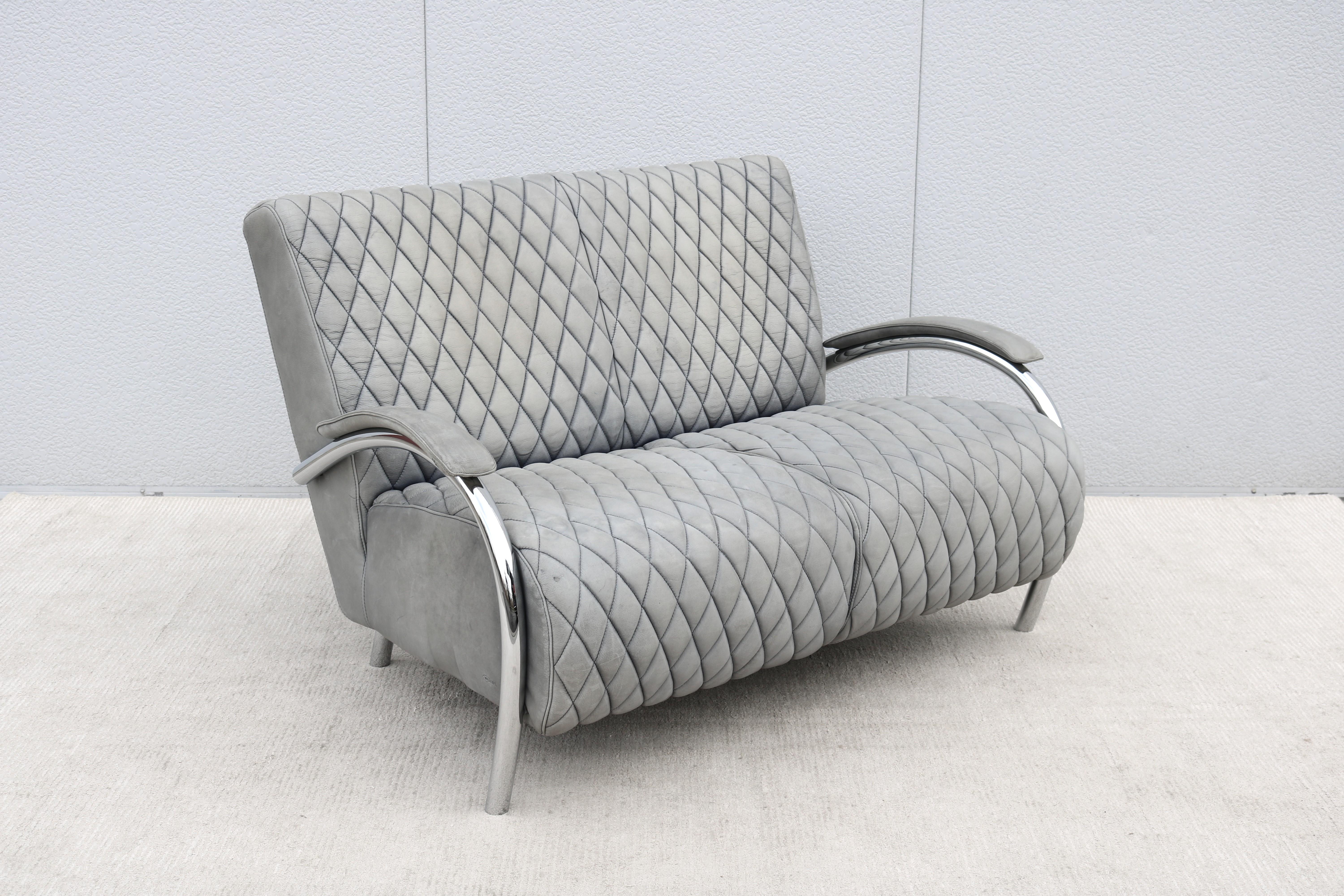 Fabulous 1970s Italian distressed leather and chrome Accademia loveseat or two-seat sofa, designed by the Dutch designer Teun van Zanten, and beautifully handcrafted with the finest quality materials and craftsmanship by the Italian furniture