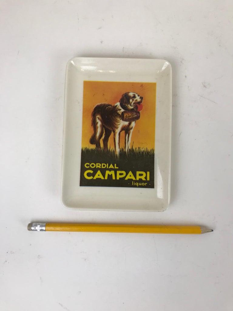 Advertising Cordial Campari Liquor little plastic tray made in Milan, Italy in the 1970s.

The tray reproduces a copy of the original adverting image for Cordial
Campari Liquor 