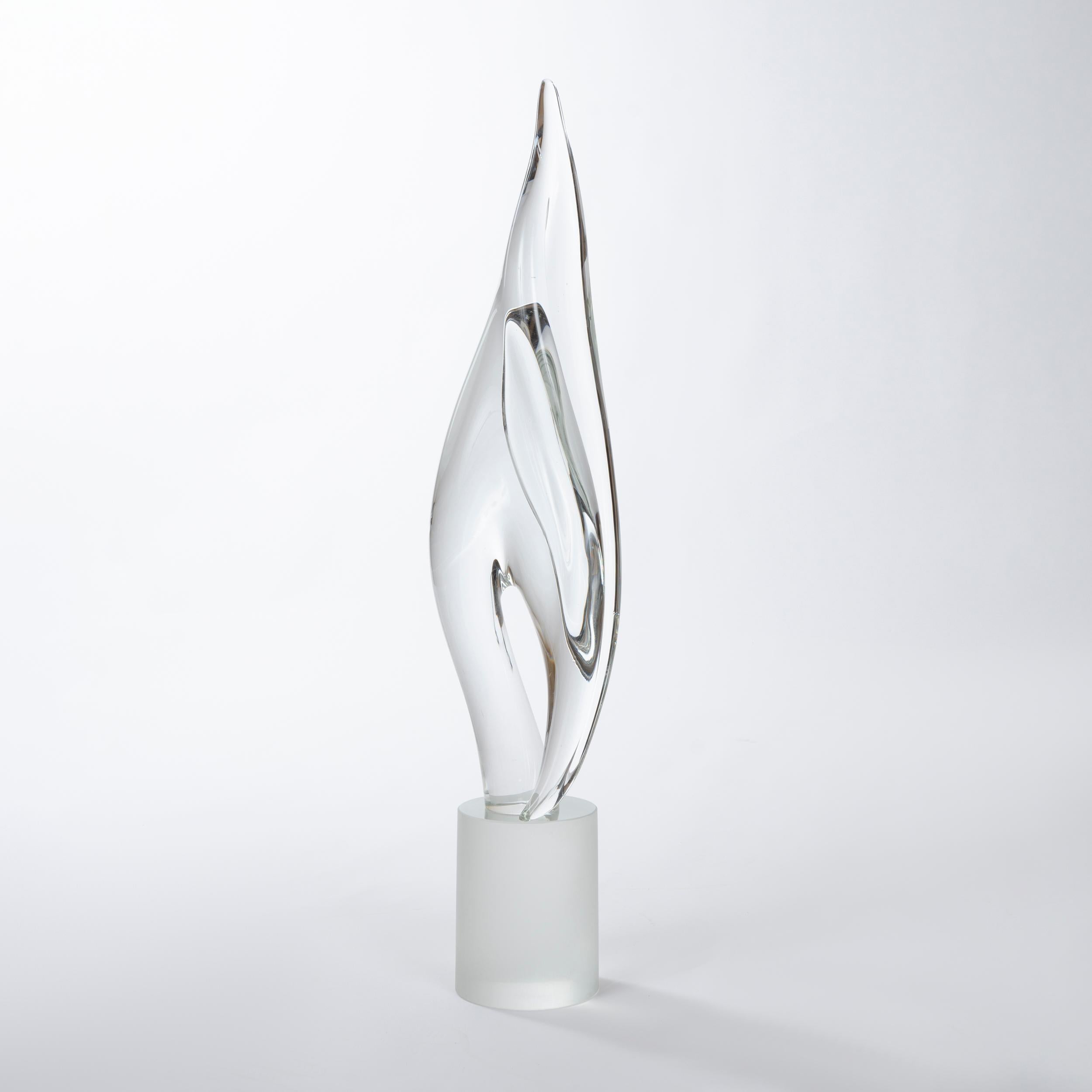 A substantial amorphic solid glass sculpture mounted to a solid frosted glass cylindrical base. Signed.