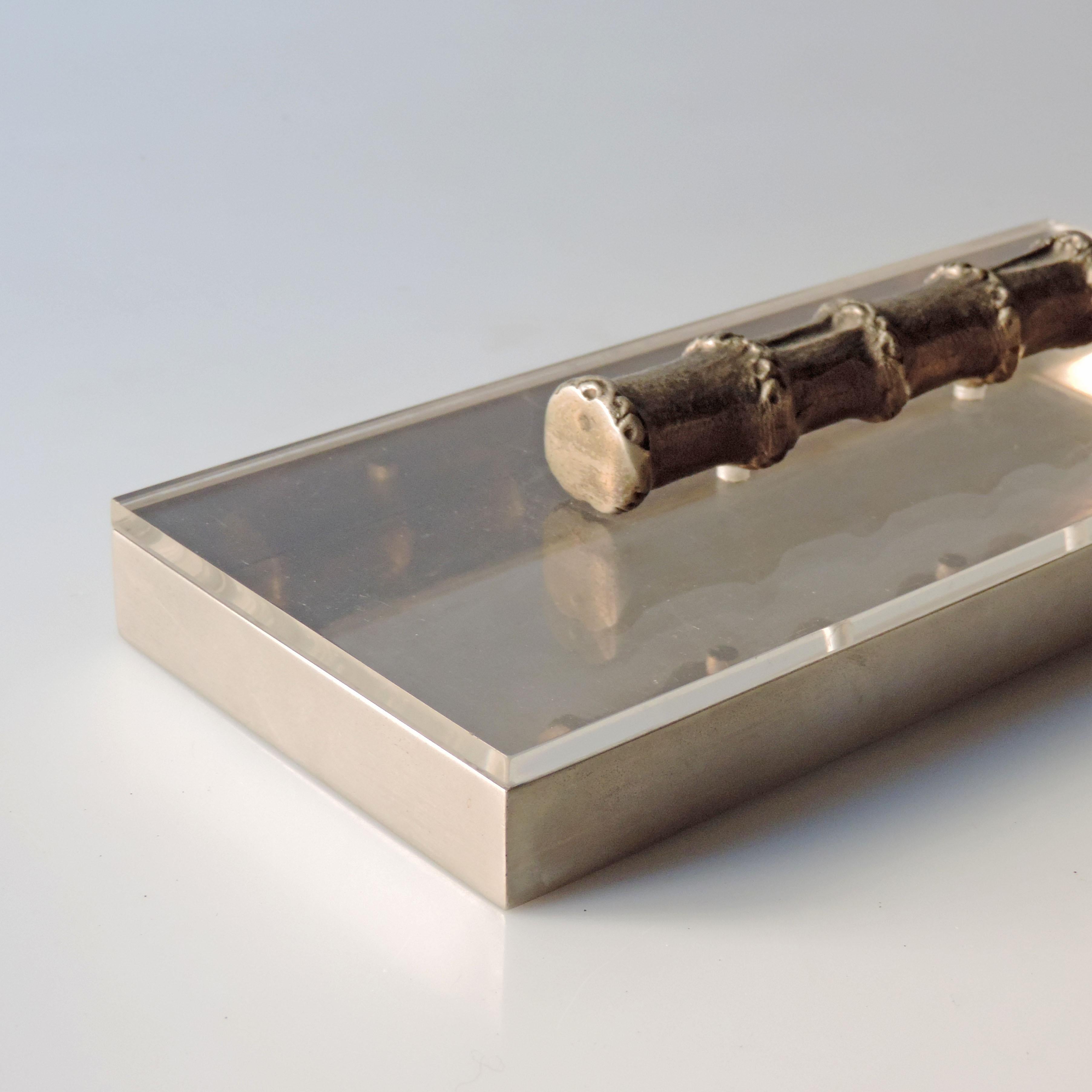 A Beautiful 1970s Faux Bamboo handle box in Nickeld Brass and Plexiglass. 
A Gem from the 1970s Bling Disco period.

 
