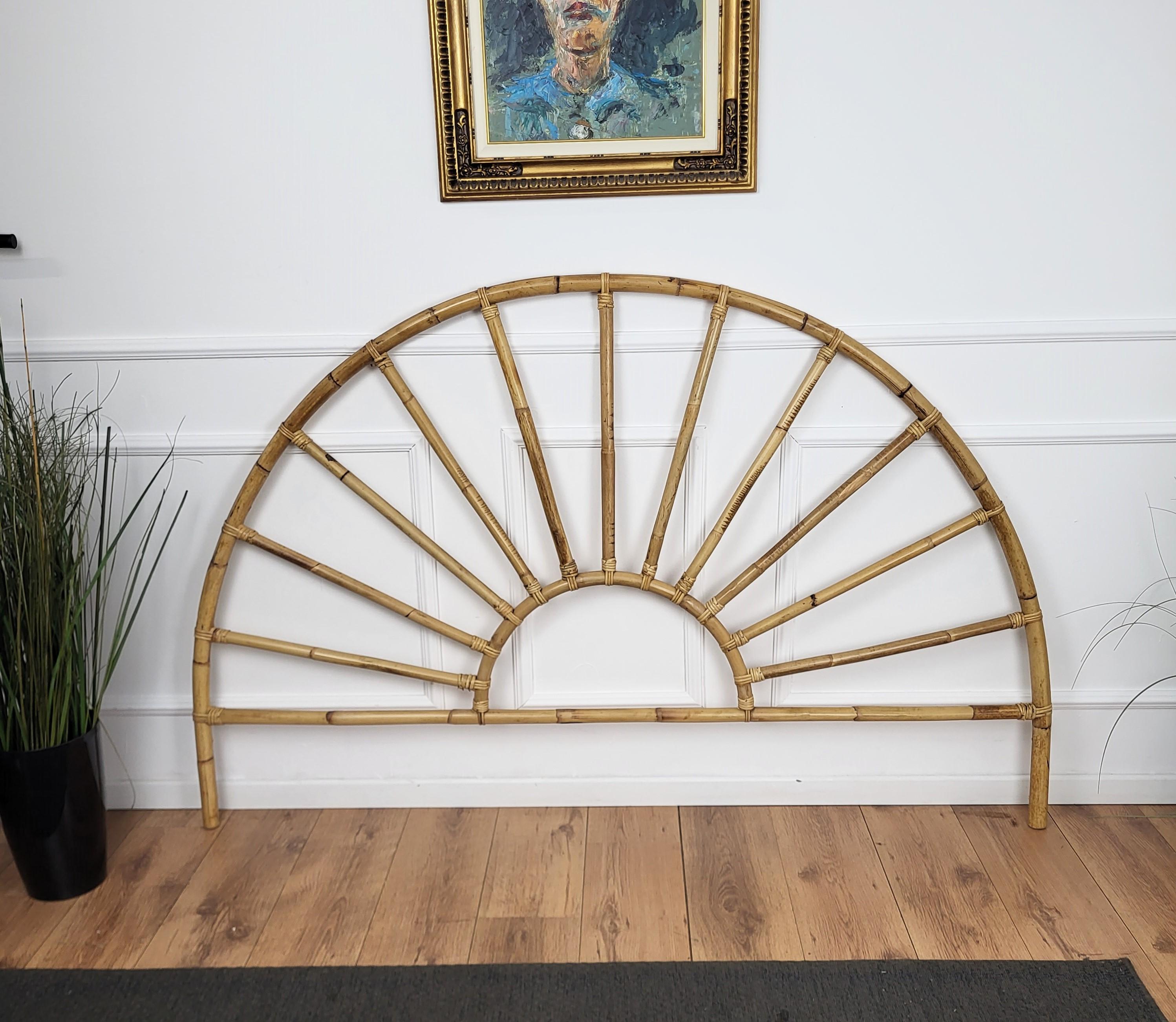 Beautiful 1970s Italian Mid-Century Modern curved sunrise shaped wall bed frame headboard made of rattan and bamboo. This charming piece is in the typical style of Franco Albini, Adrien Audoux and Vittorio Bonacina where the organic beauty of the