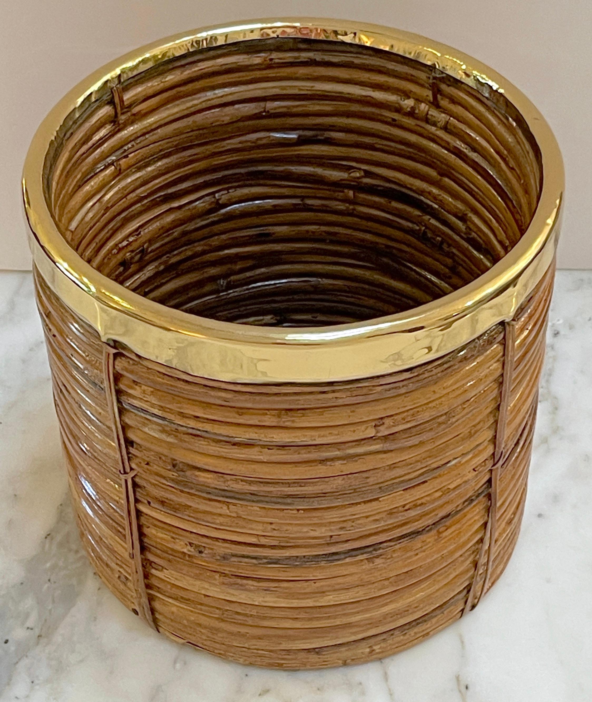 1970s Italian bamboo/ rattan wastepaper basket with polished brass rim
Mid-Century Modern decorative bamboo, rattan and brass Wastepaper basket. basket. Handcrafted in Italy, 1970s. Round in shape with professionally polished brass rim. Inspired on