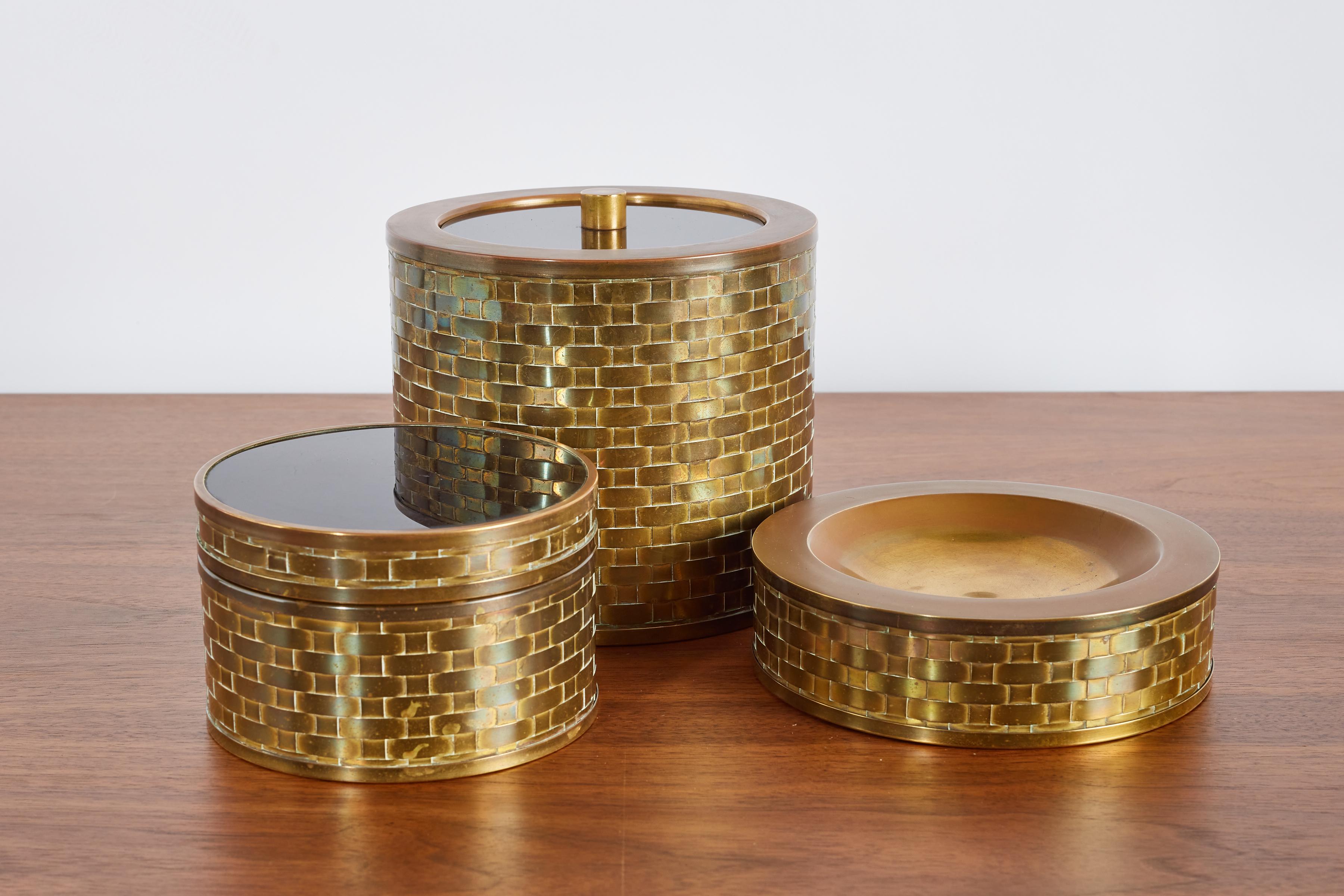 Handsome brass bar set consisting of Ice bucket, ashtray and box 
Woven brass with plexiglass lid 
Italy, 1970s 
Listing is for all 3x pieces 

Crcular box - 3.75