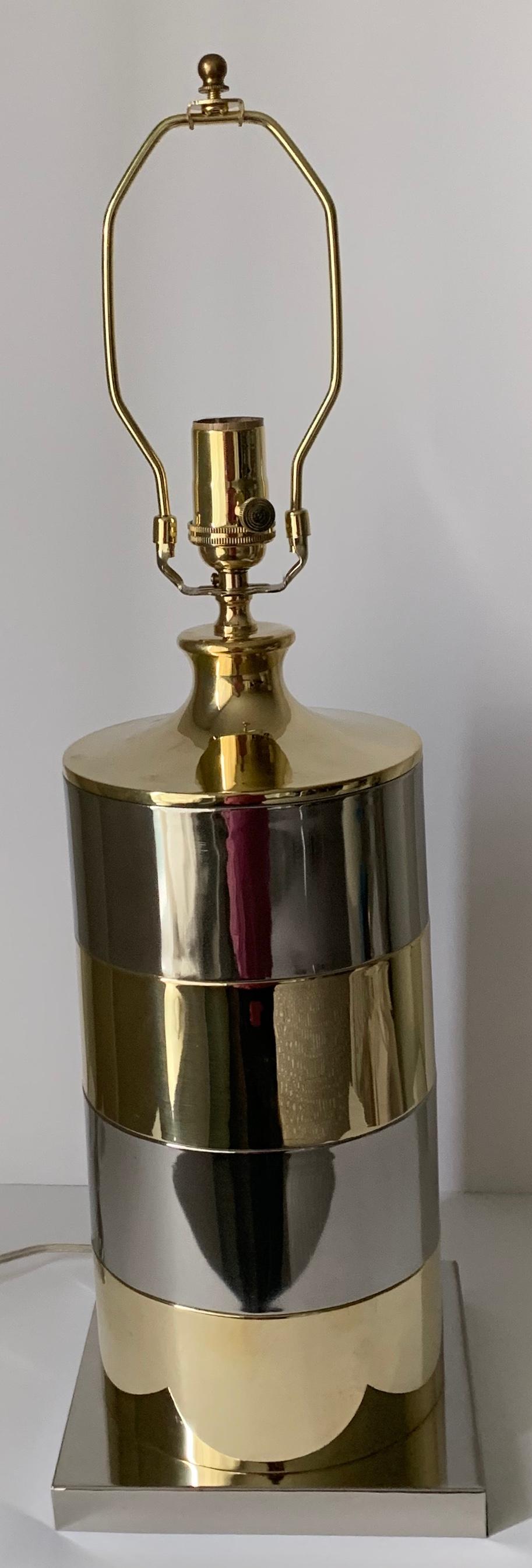 1970s Italian brass and chrome table lamp. Newly professionally polished to a high shine. Newly rewired. Takes one standard bulb. Ivory vellum paper lampshade or harp or finial are included. Lampshade measures Shade measures 12” diameter x 10” tall.