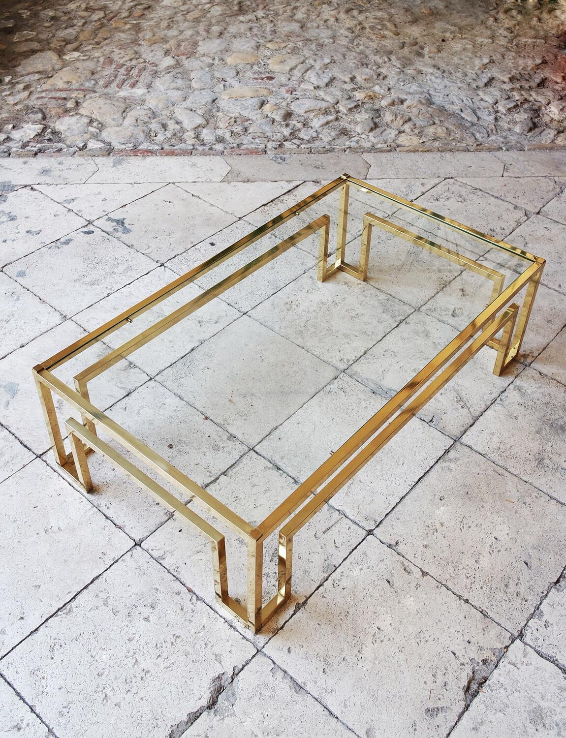A beautifully designed Italian brass coffee table. This piece has a glass top and a beautiful airy geometric brass frame. The frame is hollow and therefore light to manoeuvre. This is a classic 70s Italian design piece found in Bologna, Italy.