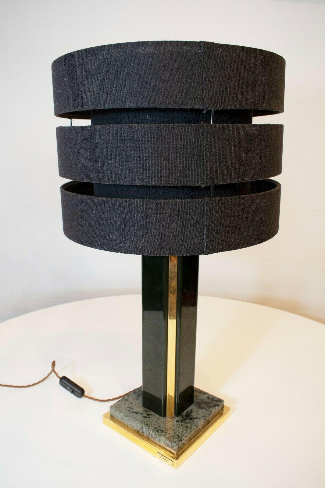 A super sleek and stylish 1970's Italian brass and marble lamp by Fedam.

Set upon a marble base, this lamp features a black lacquered stem with brass detailing.