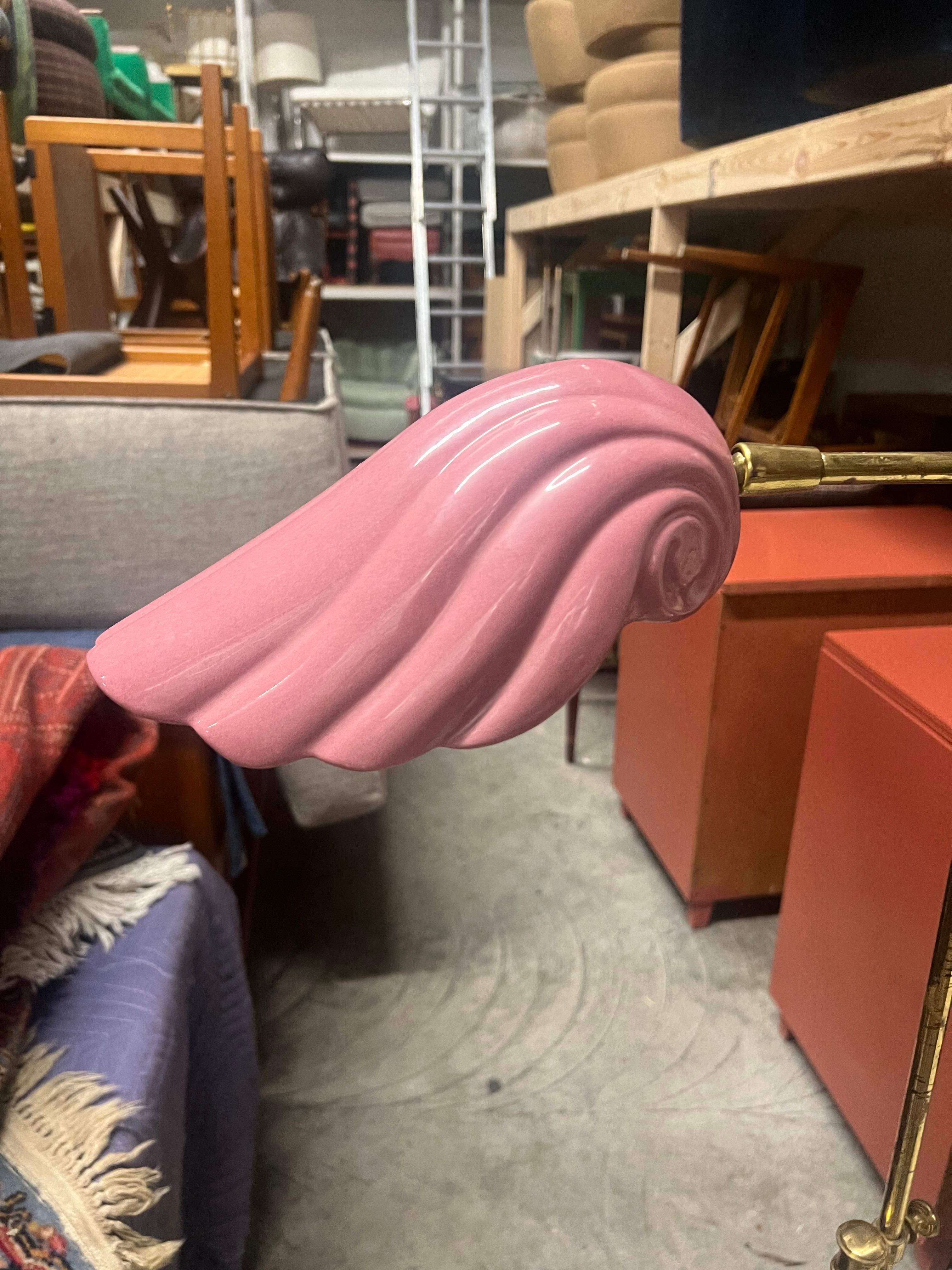 Circa 1960's Italian reading lamp. Pivoting ceramic scallop shell shade on adjustable height base in the manner of Tommaso Barbi. The porcelain shade is in a shell form, and the pink is absolutely fantastic!   It is quite rare to find one in this