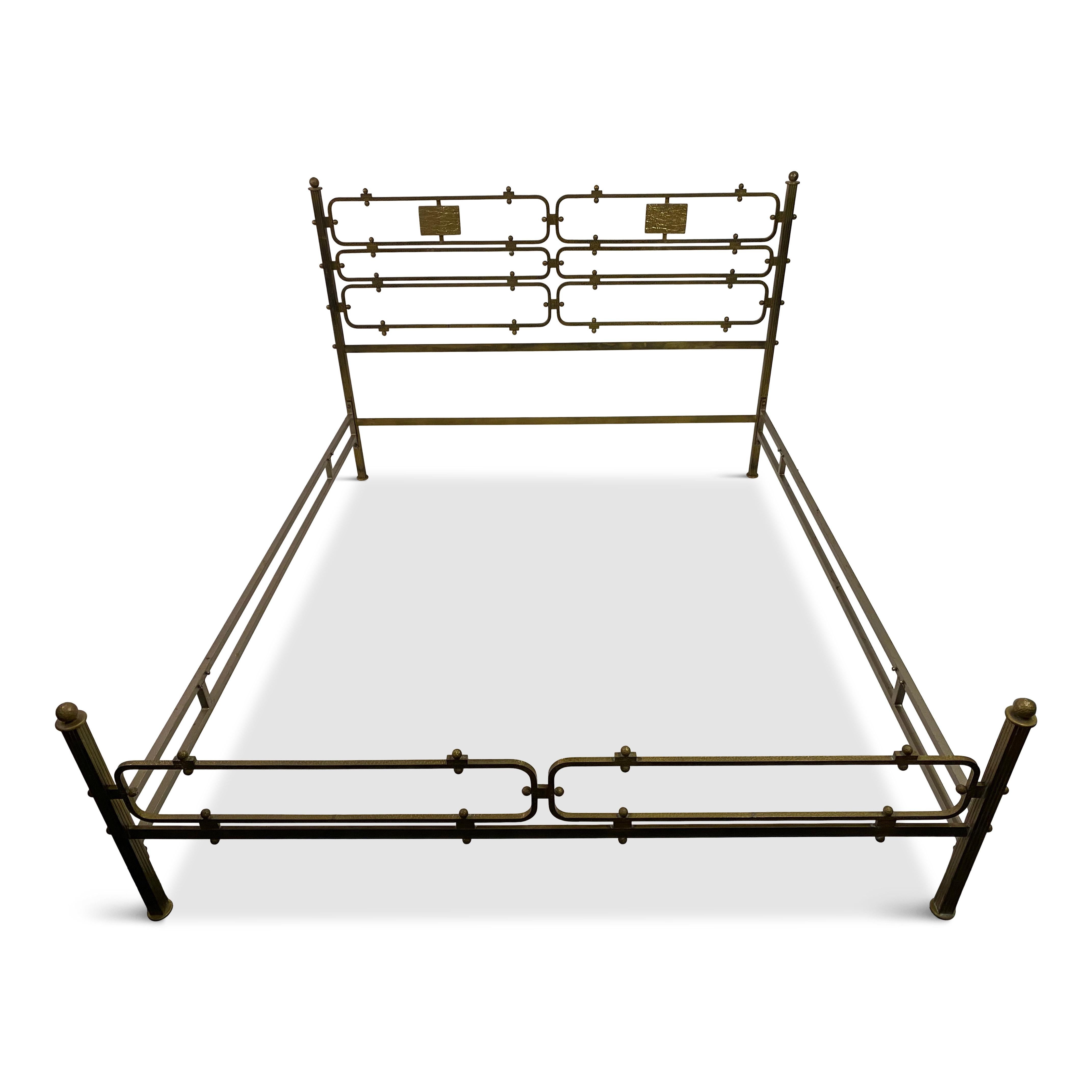 Bed frame.

By Luciano Frigerio.

Brass.

Hammered brass details.

Bed head and foot joined by steel side stretchers.

Internal measurement is 200 x 167 cm.

1970s Italian.
