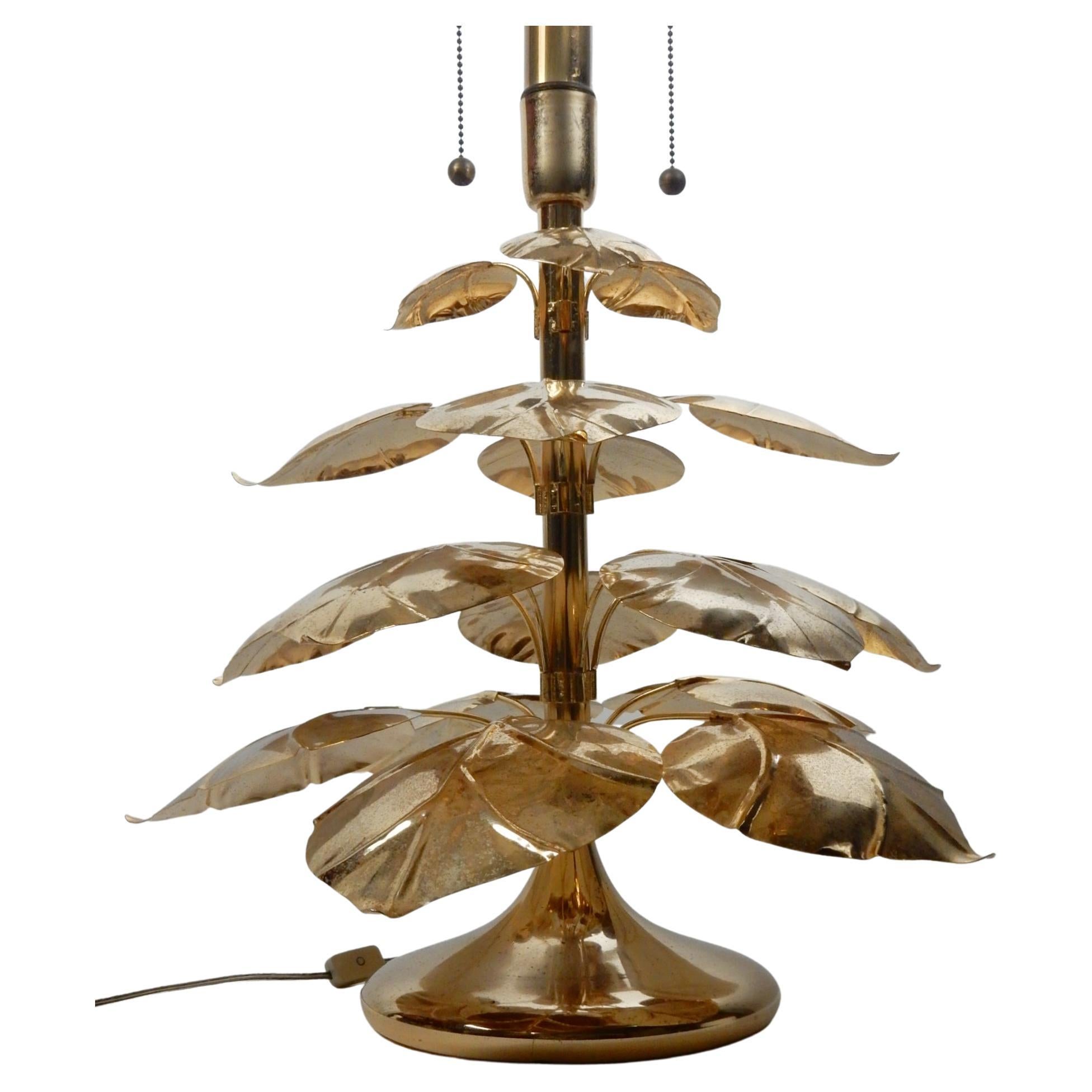 Incredible stylized brass broad leaf plant sculpture table lamp.
Unique statement piece for an eclectic decorum.
Made in Italy circa 1970's.
Requires 2 standard light bulbs. Off/On switch in cord
as well as pull chain for each socket.
Works