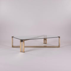 Mesa de centro italiana de los años 70, de latón, cromo y cristal, con diseño cruzado
