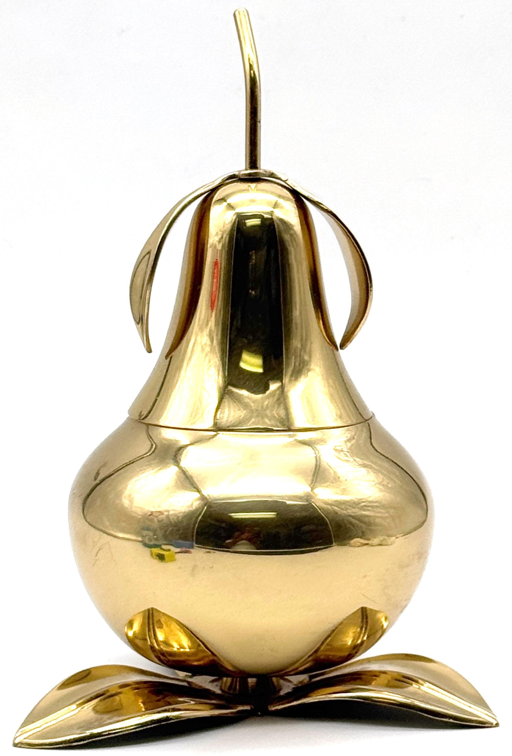  1970s Italian Brass Pear Form Lidded Table Box on Leaf Base

A bold and playful 1970s Italian sculptural box in the form of a stylized pear, crafted in polished brass and resting on a naturalistic leaf-form base. The hinged lid opens at the