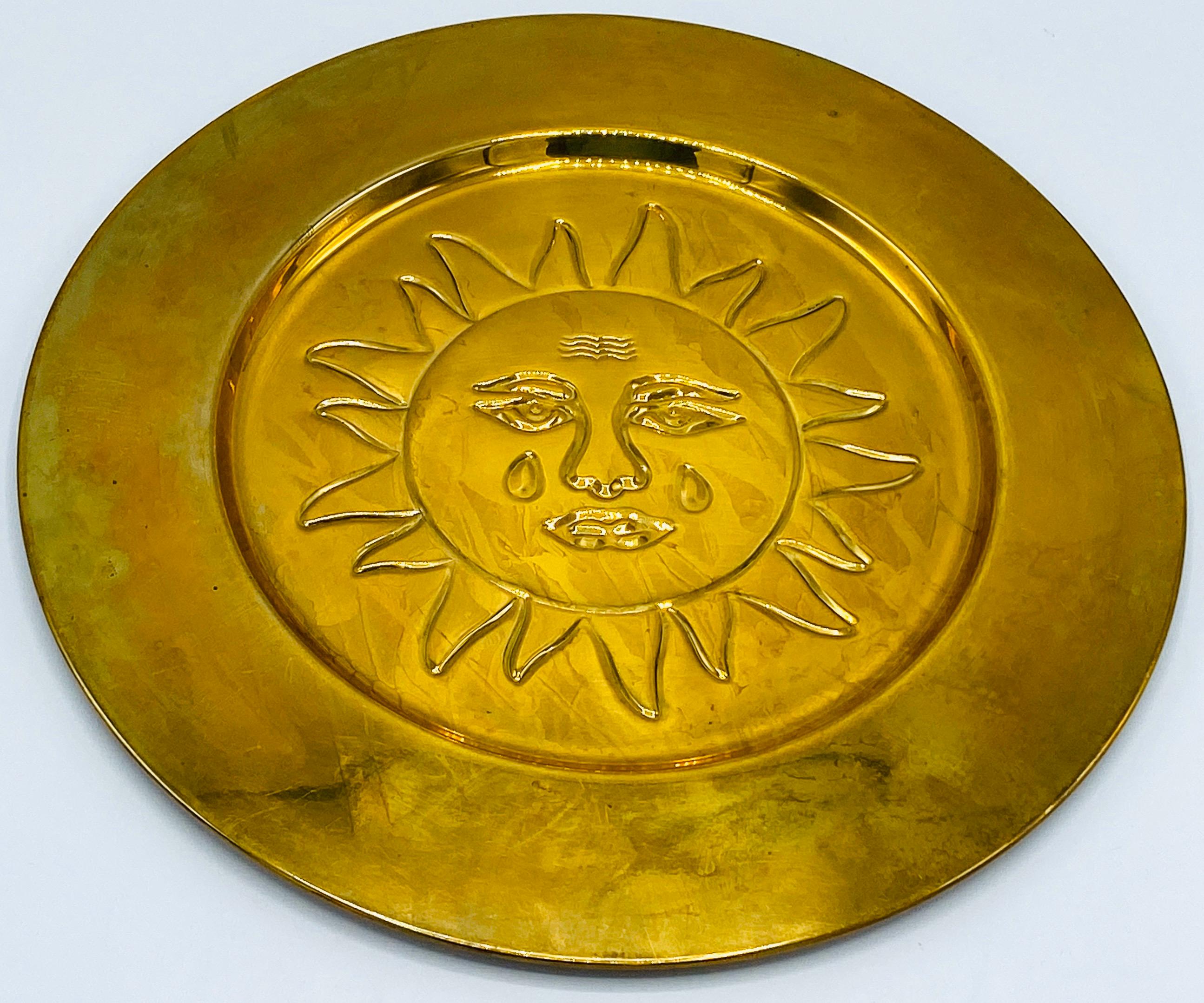 Listed is a fabulous, set of 6, 1970s Italian brass sun charger plates, in the style of Sergio Bustamante. Each plate has an identical, debossed sun motif in the center with a thick rim. Would be perfect for their intended use of chargers, or a