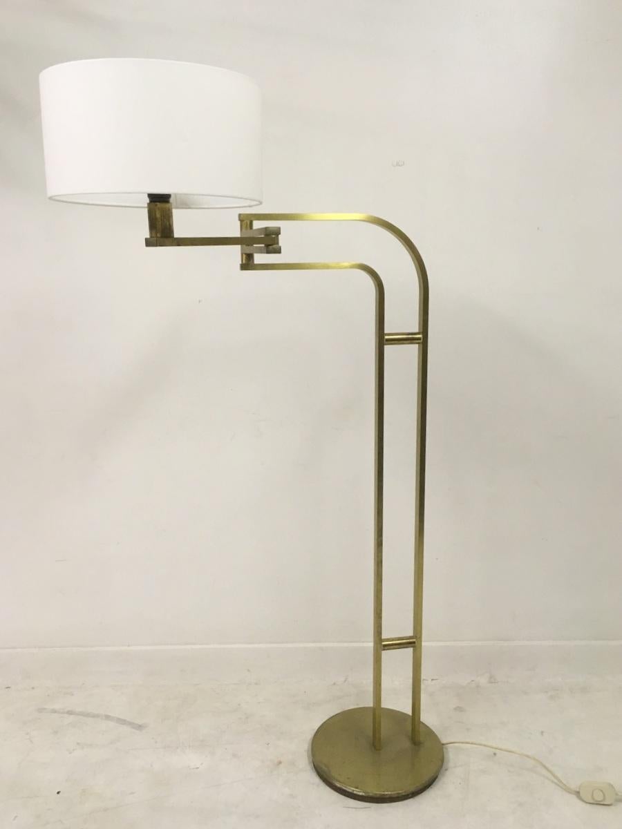 1970s Italian brass swing floor lamp by Reggiani.
Stamped under the base.
Two articulating points and new shade.