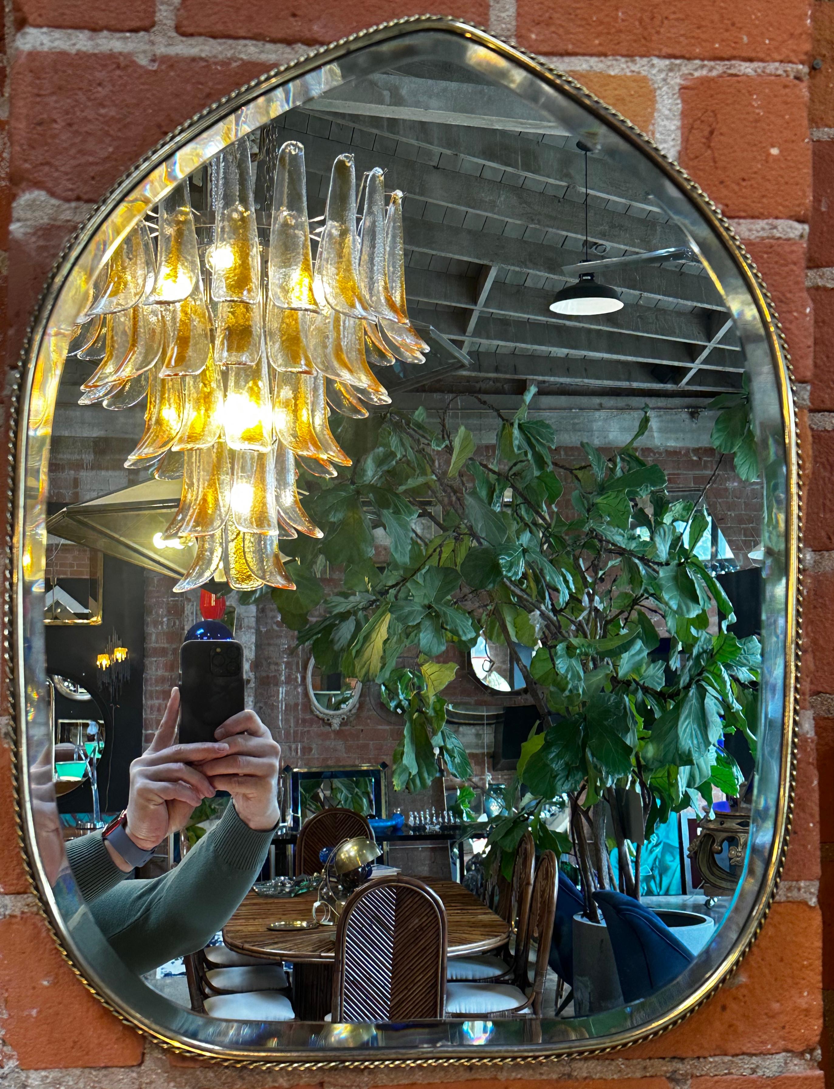 1970s Italian brass wall mirror.
 