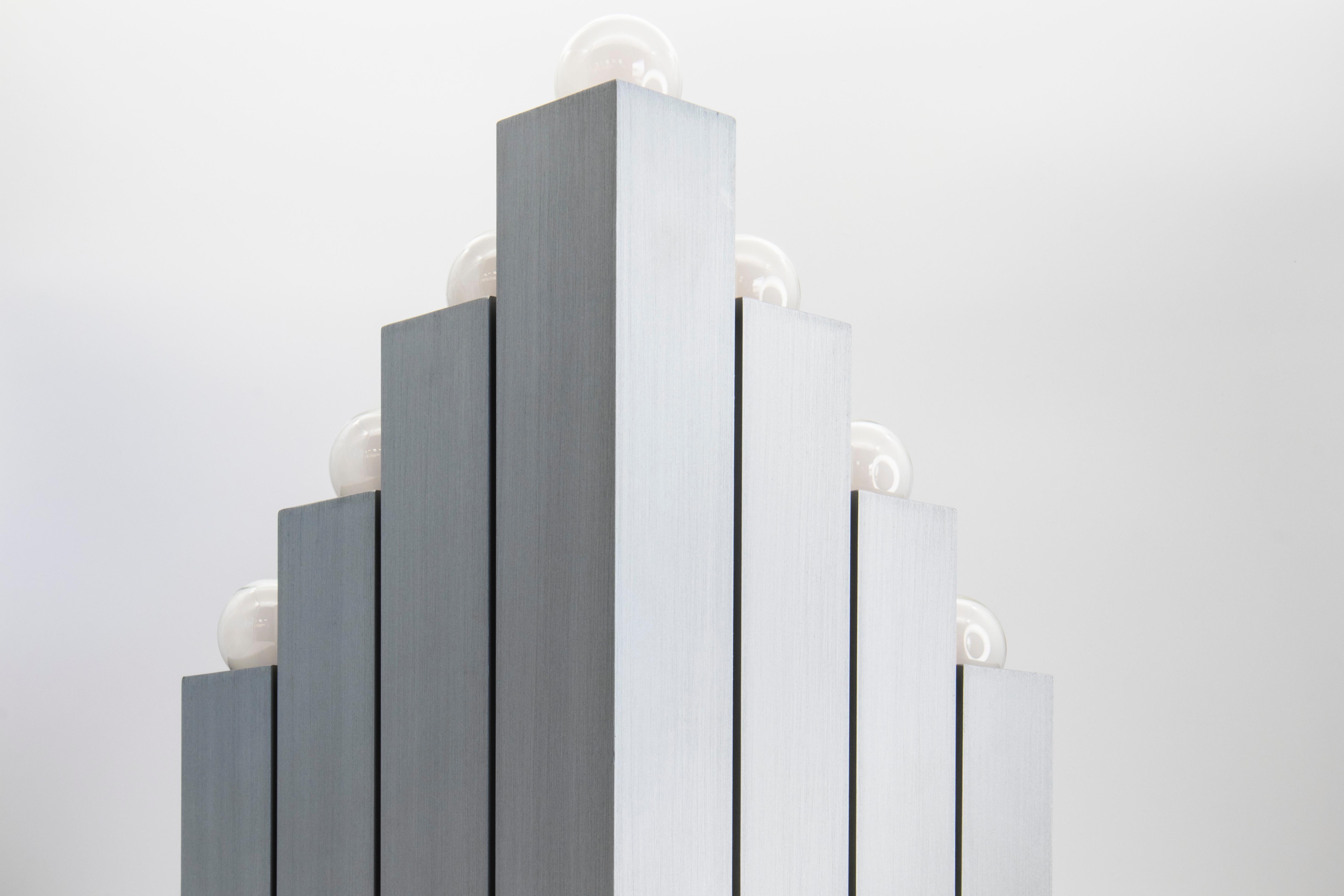 Stunning 16-bulb Brutalist 1970s Italian floor lamp. Comprised of 16 brushed aluminum square profile tubes of differing lengths and stacked in a four by four matrix. Mesmerizing to look at from every angle.