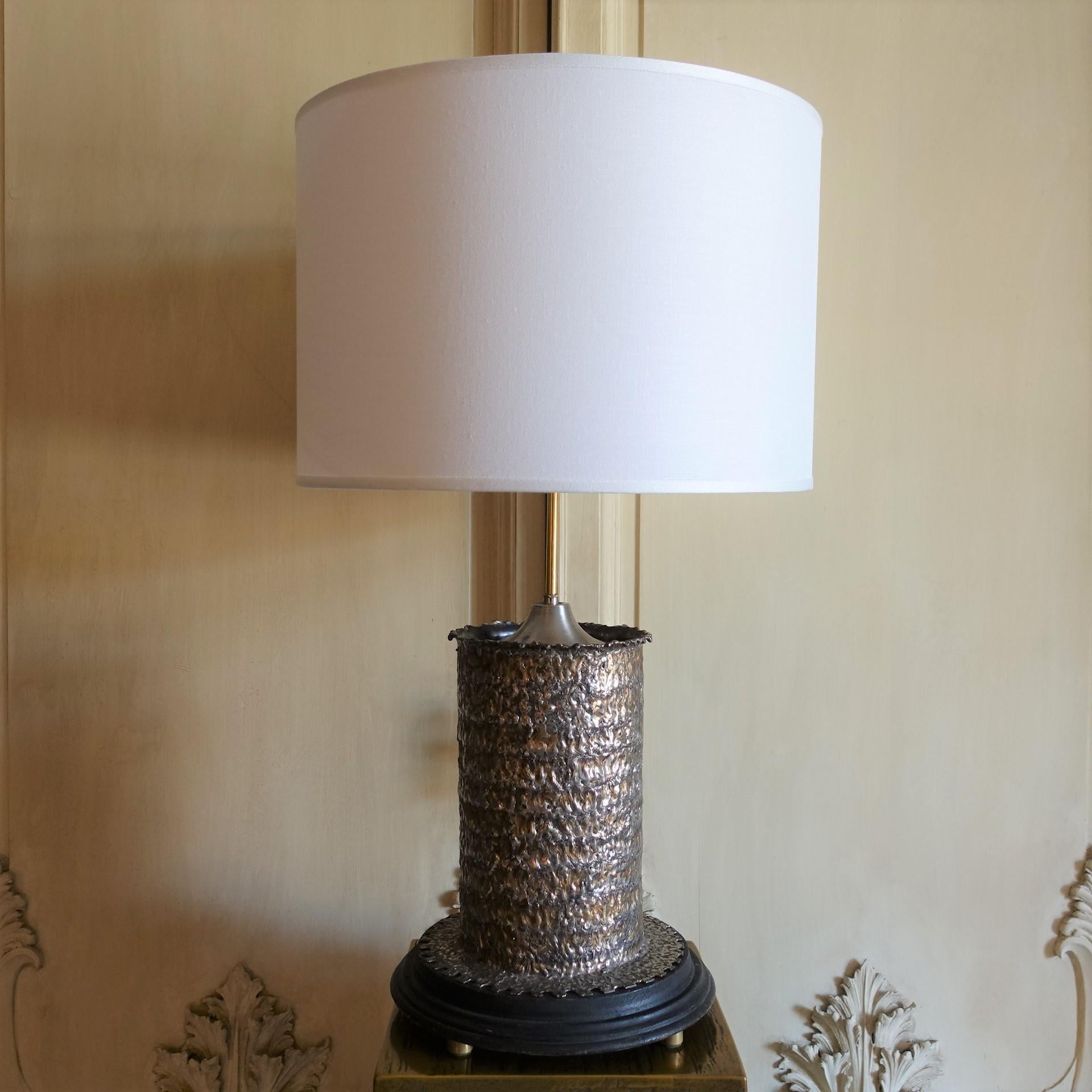 One of a kind brutalist metal cylinder table lamp, wood base, steel and brass details, vintage patina, base measures cm Diameter 30xh.56, lampshade cm Diameter 45xh.30, total height cm78, Italy 1970's circa.