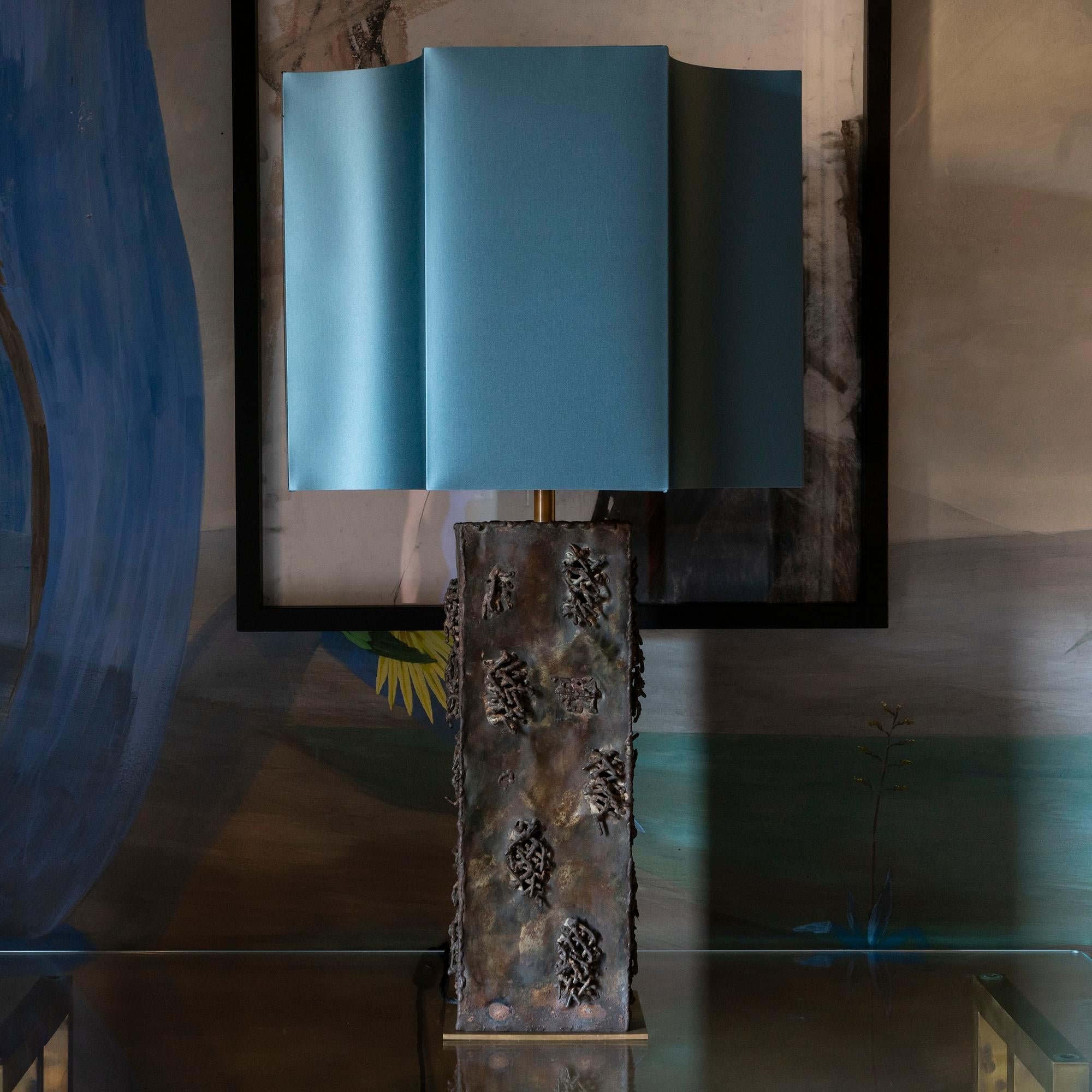 Table lamp in brut steel with vintage patina, visible cuts and weldings, lamp measurements are cm20x20x h.60 plus silk lampshade cm50x50x h.40, total high cm94, Italy 1970's circa.