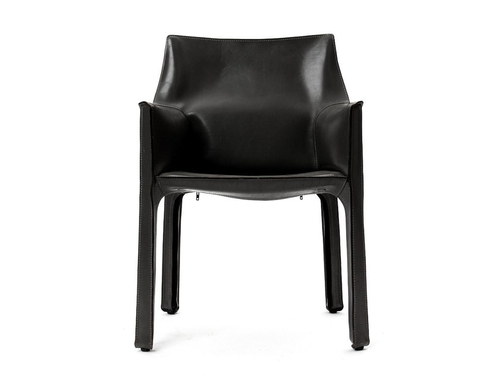 An Italian Mid-Century Modern armchair designed by Mario Bellini featuring handstitched black leather upholstery wrapped over internal steel frame. Manufactured by Cassina in Italy, circa 1977.