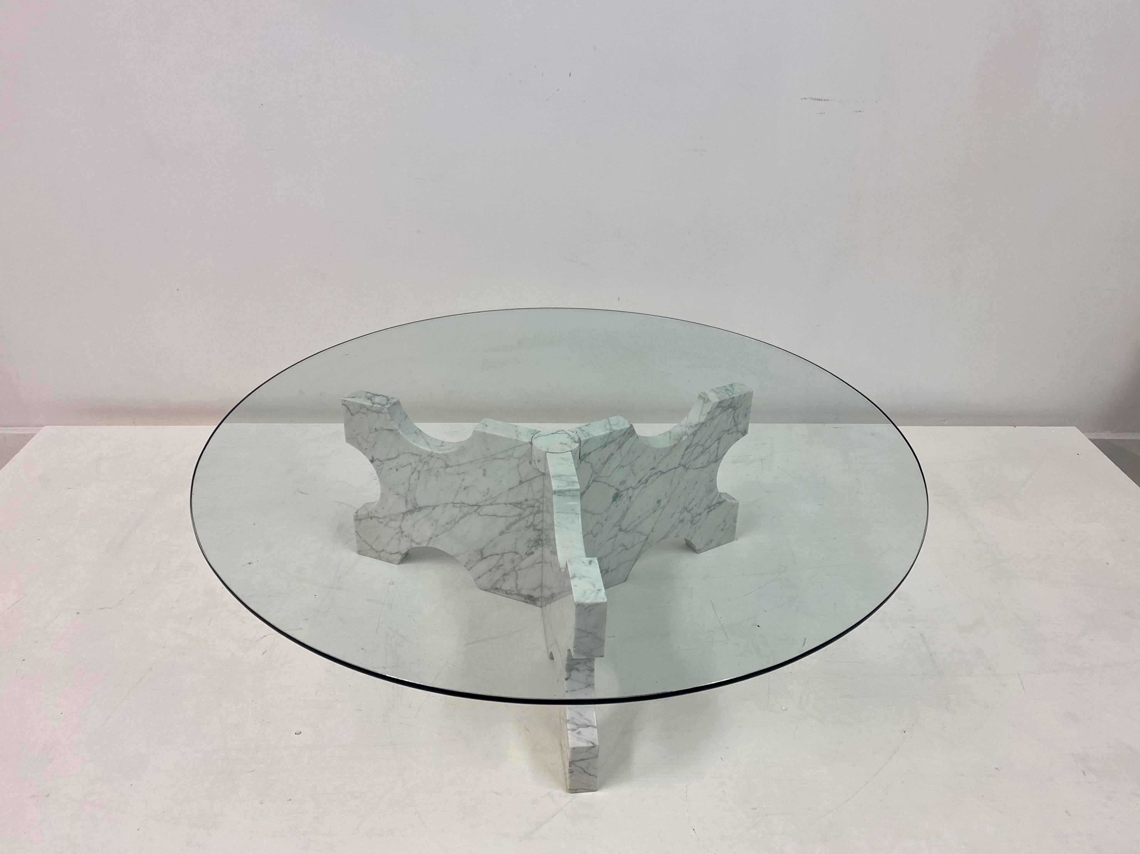 Carrara marble coffee table

Shaped base

Glass top

Italy 1970s.