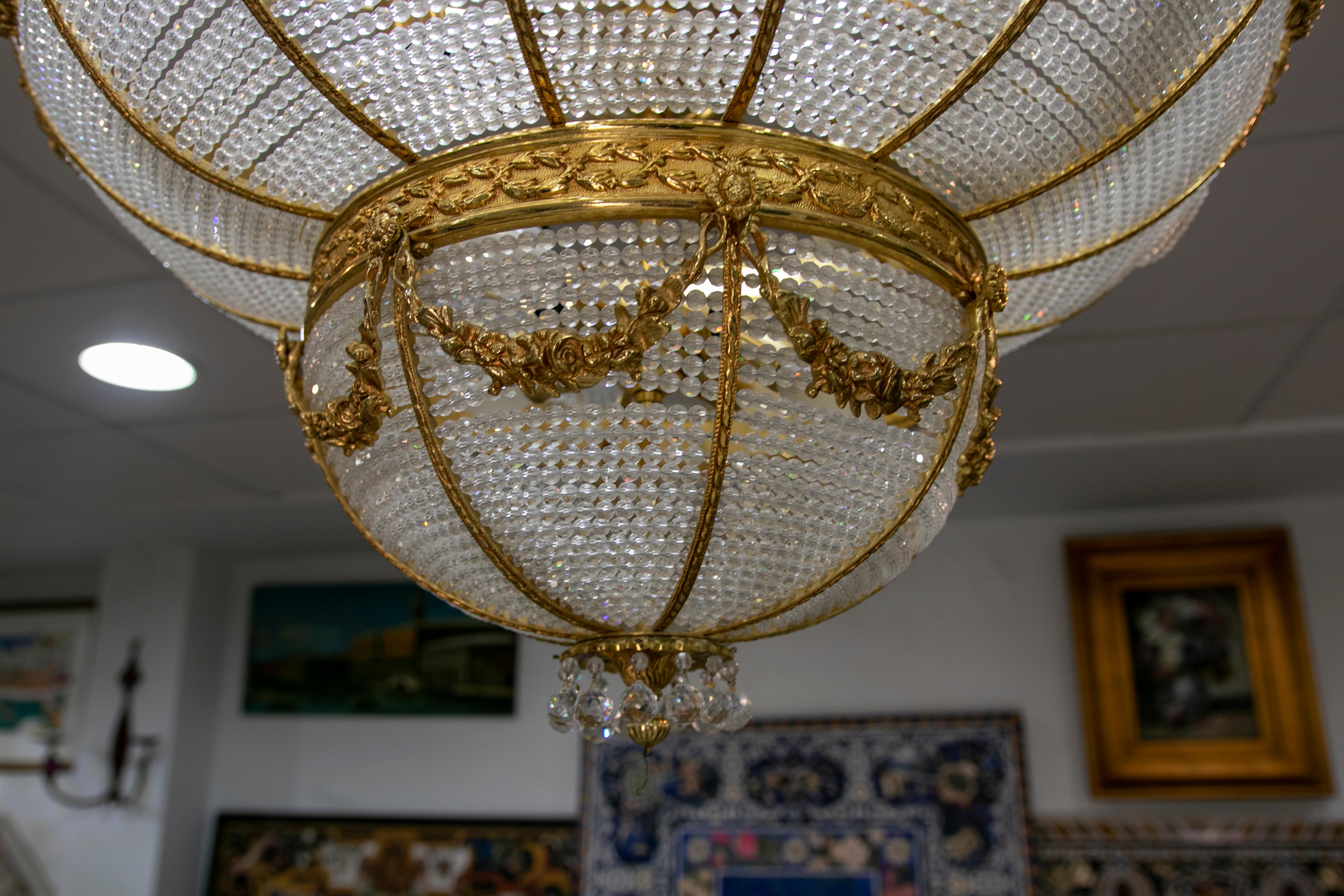 1970s Italian ceiling lamp in glass and gilded bronze.