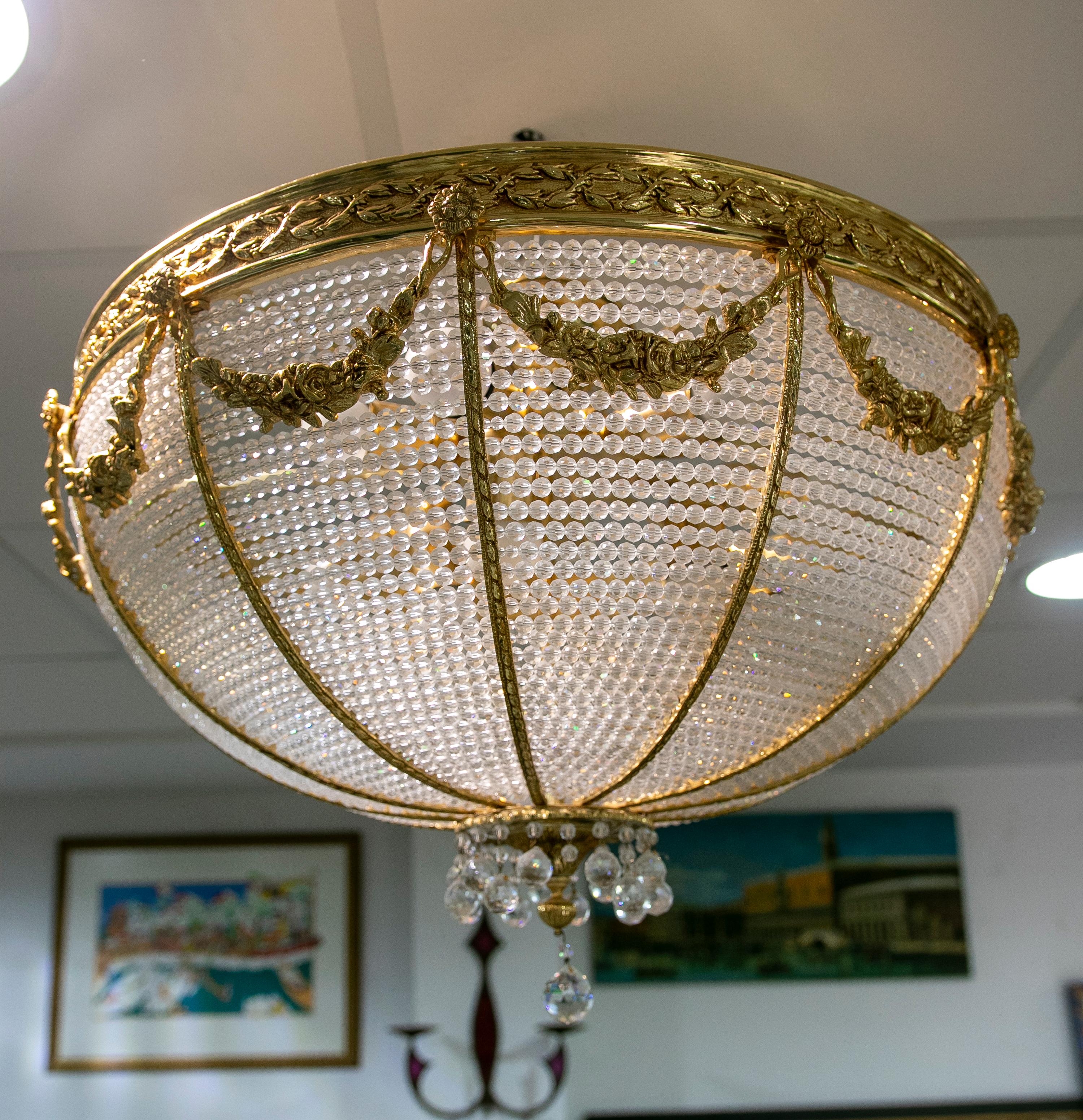 1970s Italian ceiling lamp in glass and gilded bronze.