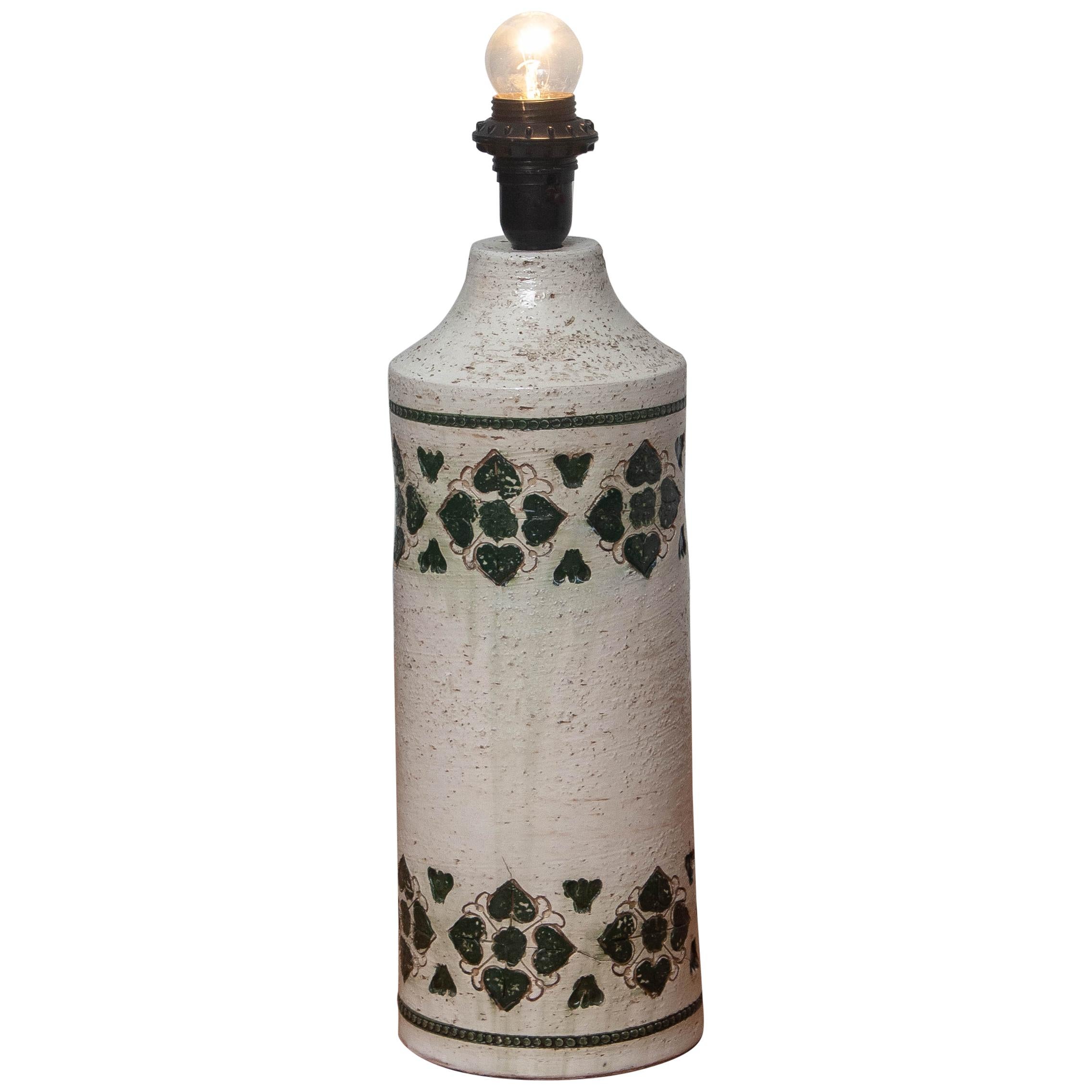 Very nice Italian ceramic lamp with an incised ivory/white and dark green geometric pattern.
This lamp is made by Bitossi for Bergboms.
  