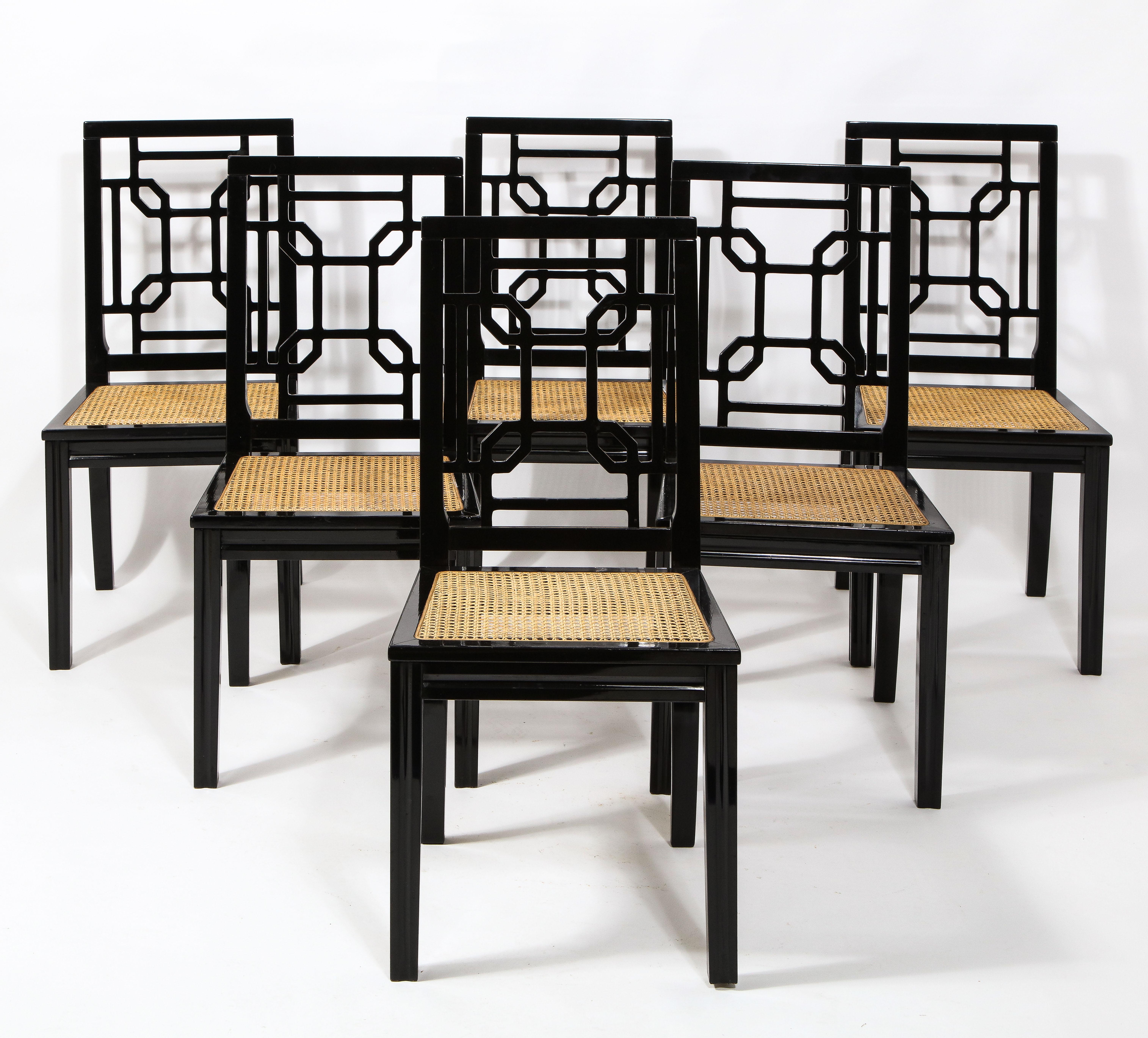 Set of six 1970s Italian chinoiserie style black lacquer and cane dining chairs by Montina, in the style of Maison Jansen. Black lacquered wood frame with cane seating. 

Overall in good vintage condition, sturdy and stable; minor scratches and