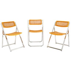 1970 Italian Chrome and Cane Folding Dining Chairs by Arben (Chaises de salle à manger pliantes en chrome et en rotin)